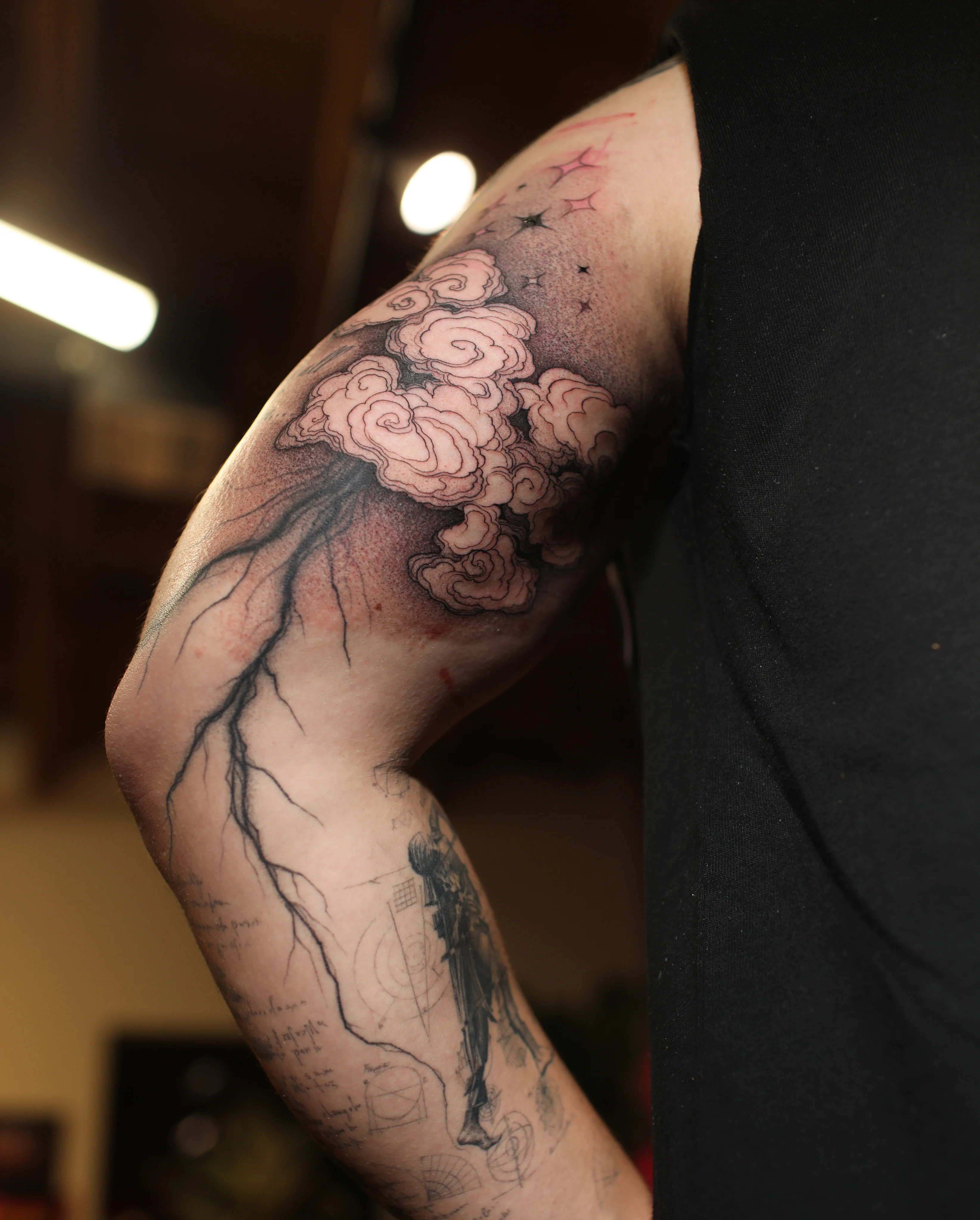 Black & Gray Realism tattoo by Konstantin Strokin: clouds, lightning, stars, human figure