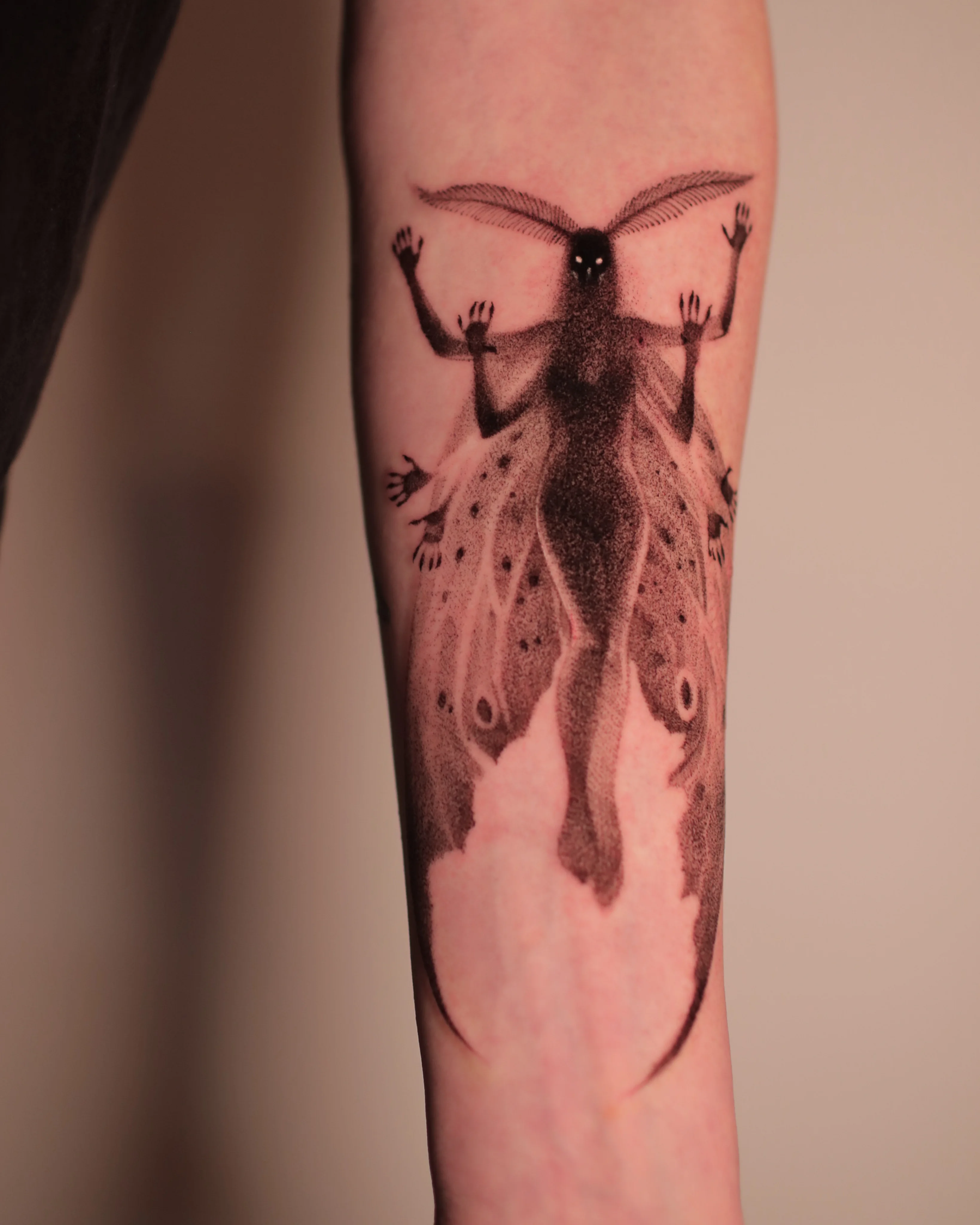 Surrealism tattoo by Konstantin Strokin: moth, female figure, multiple arms, glowing eyes