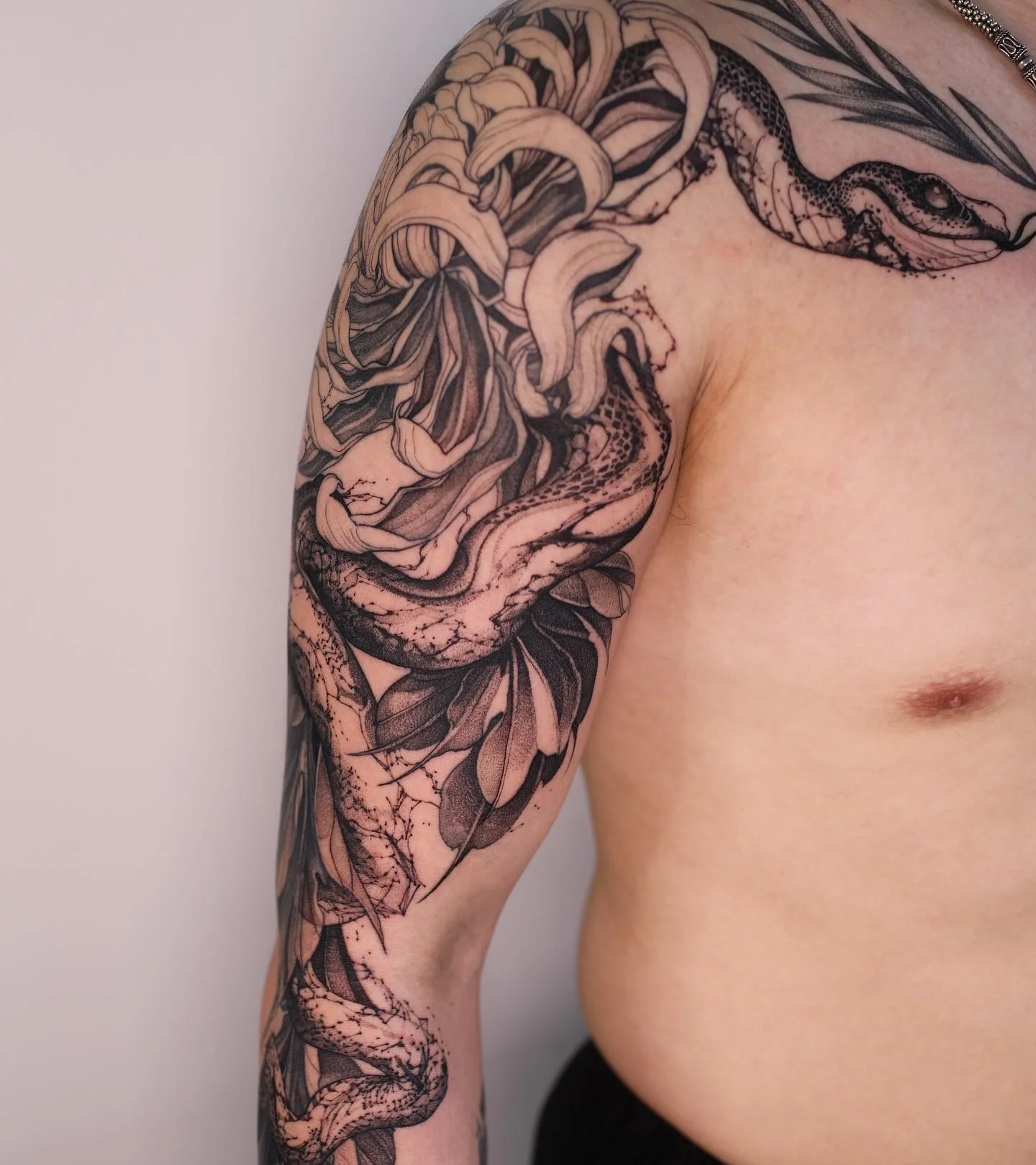 Black & Gray Realism tattoo by Konstantin Strokin: snake, lily, leaves, nature