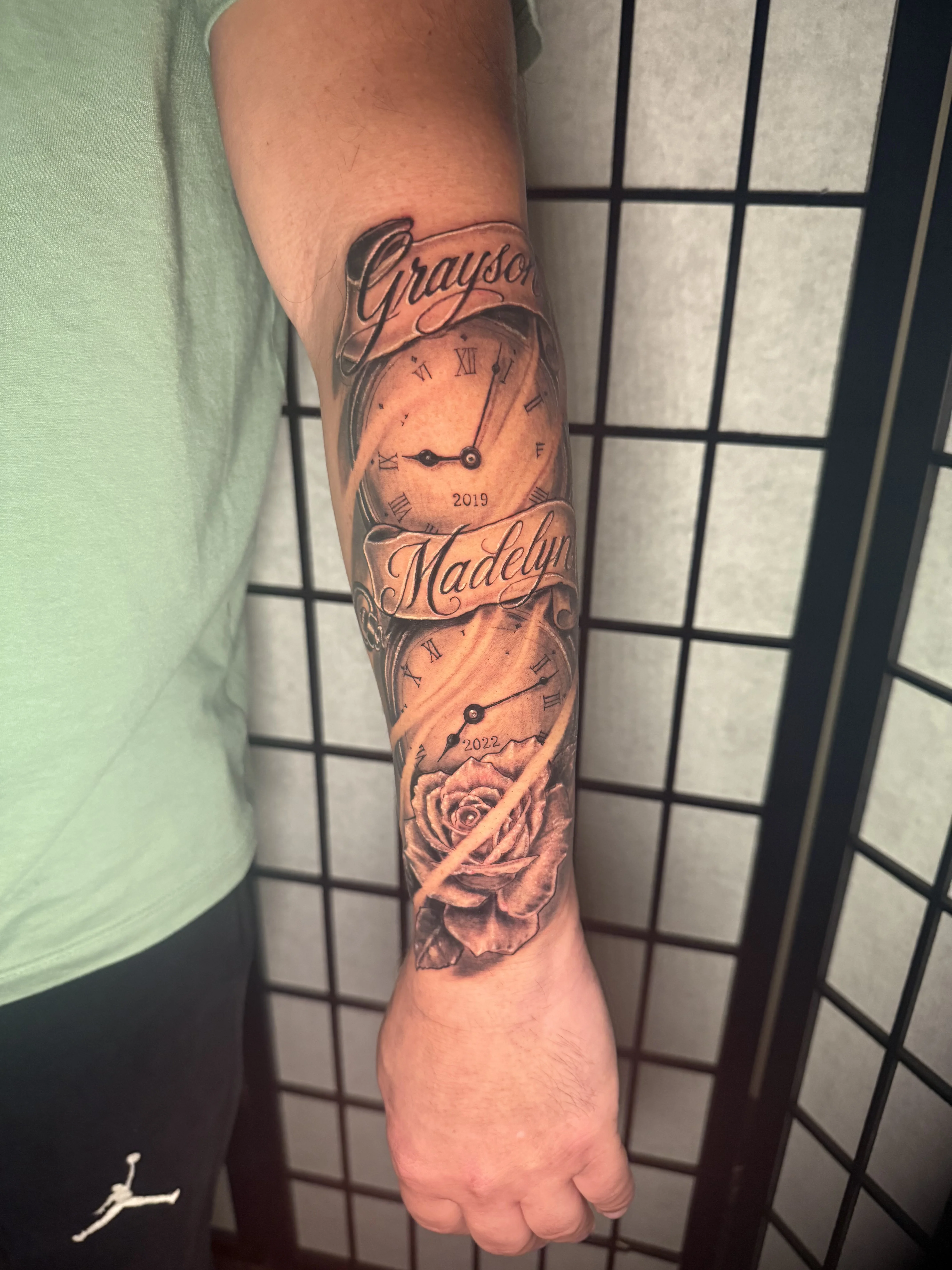 Black & Gray Realism tattoo by Donnie Chapman: clock, rose, script, banner