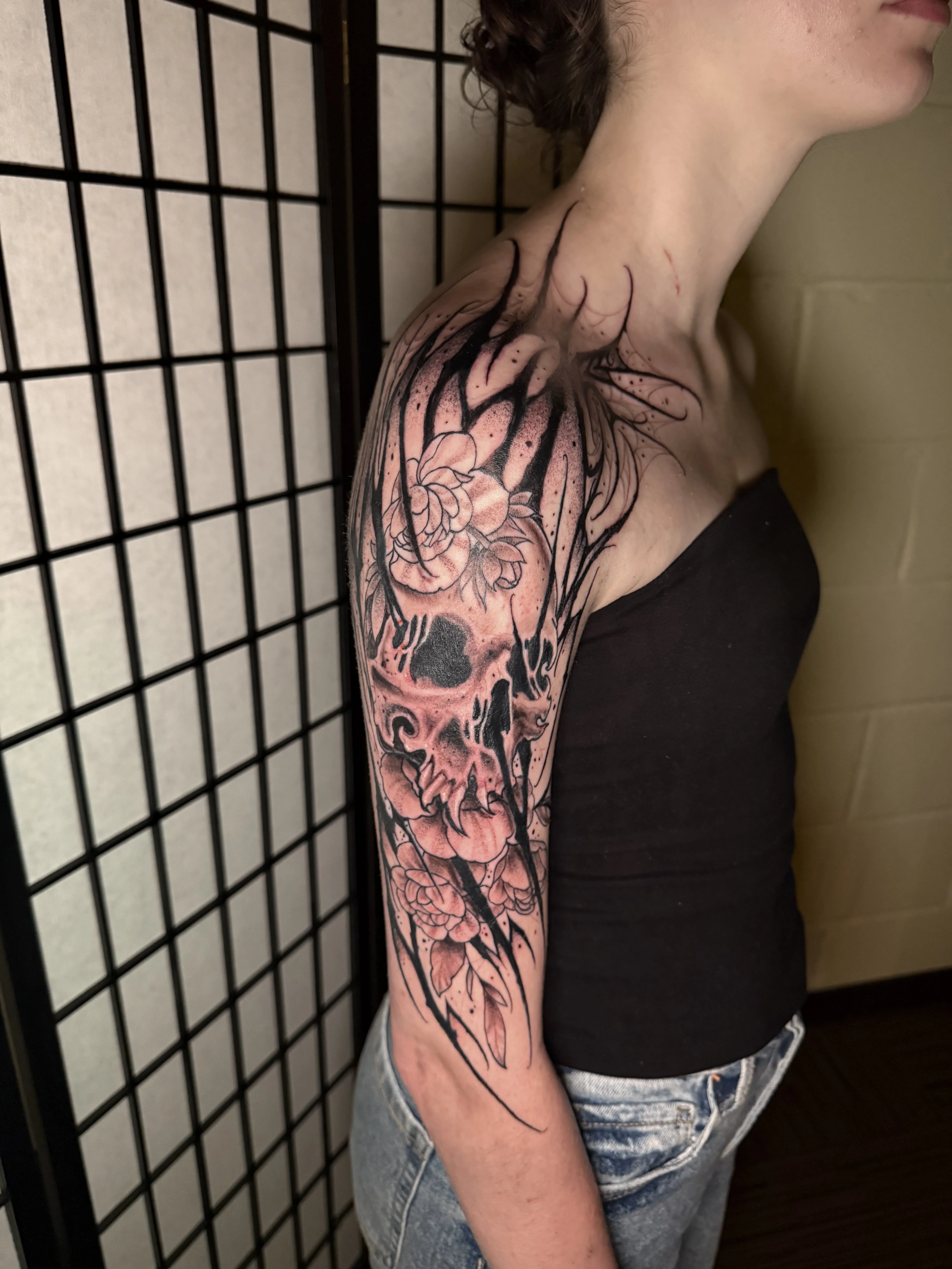 Black & Gray Realism tattoo by Donnie Chapman: skull, flowers, leaves, horns