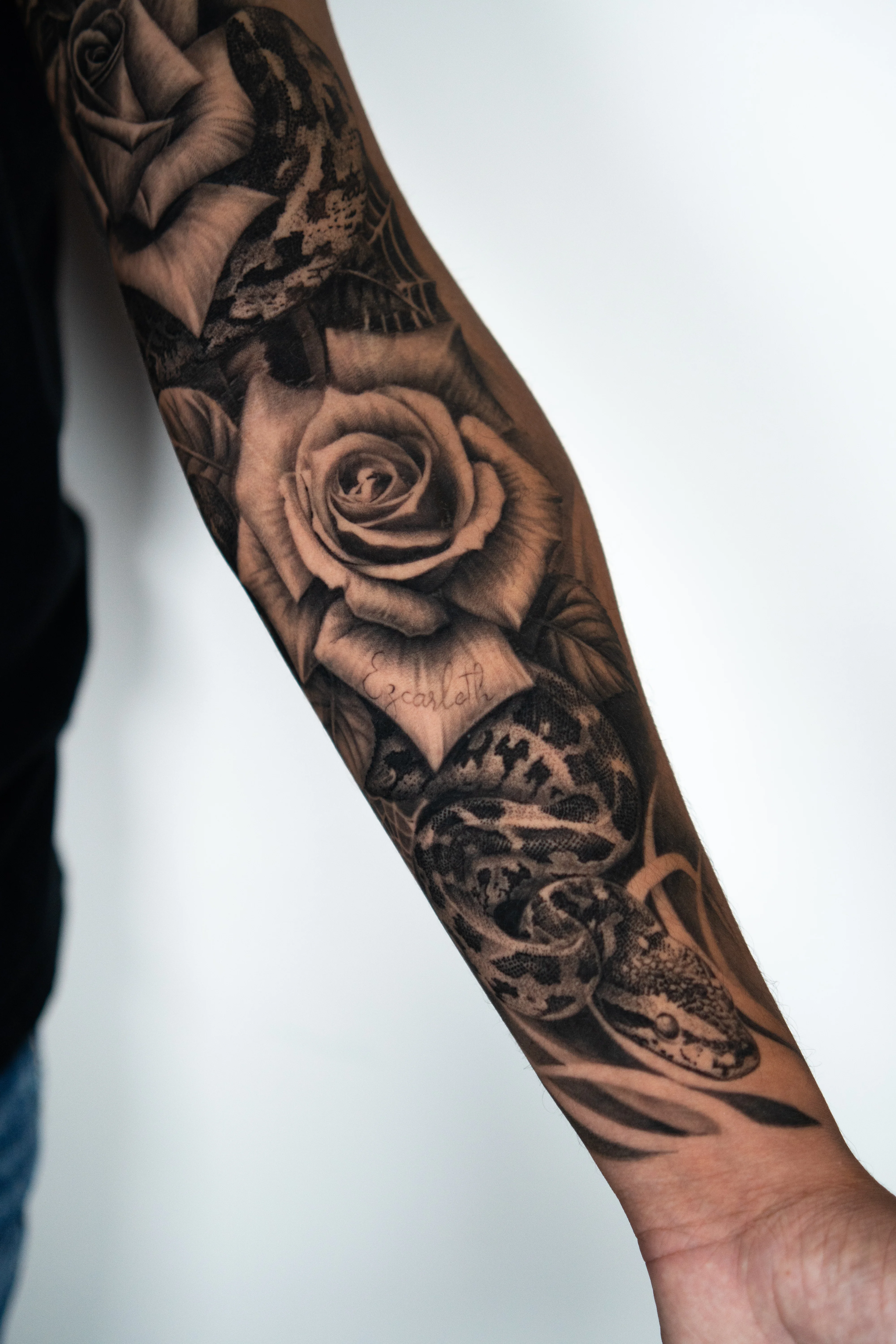 Black & Gray Realism tattoo by Do Santos: rose, snake, floral, animal