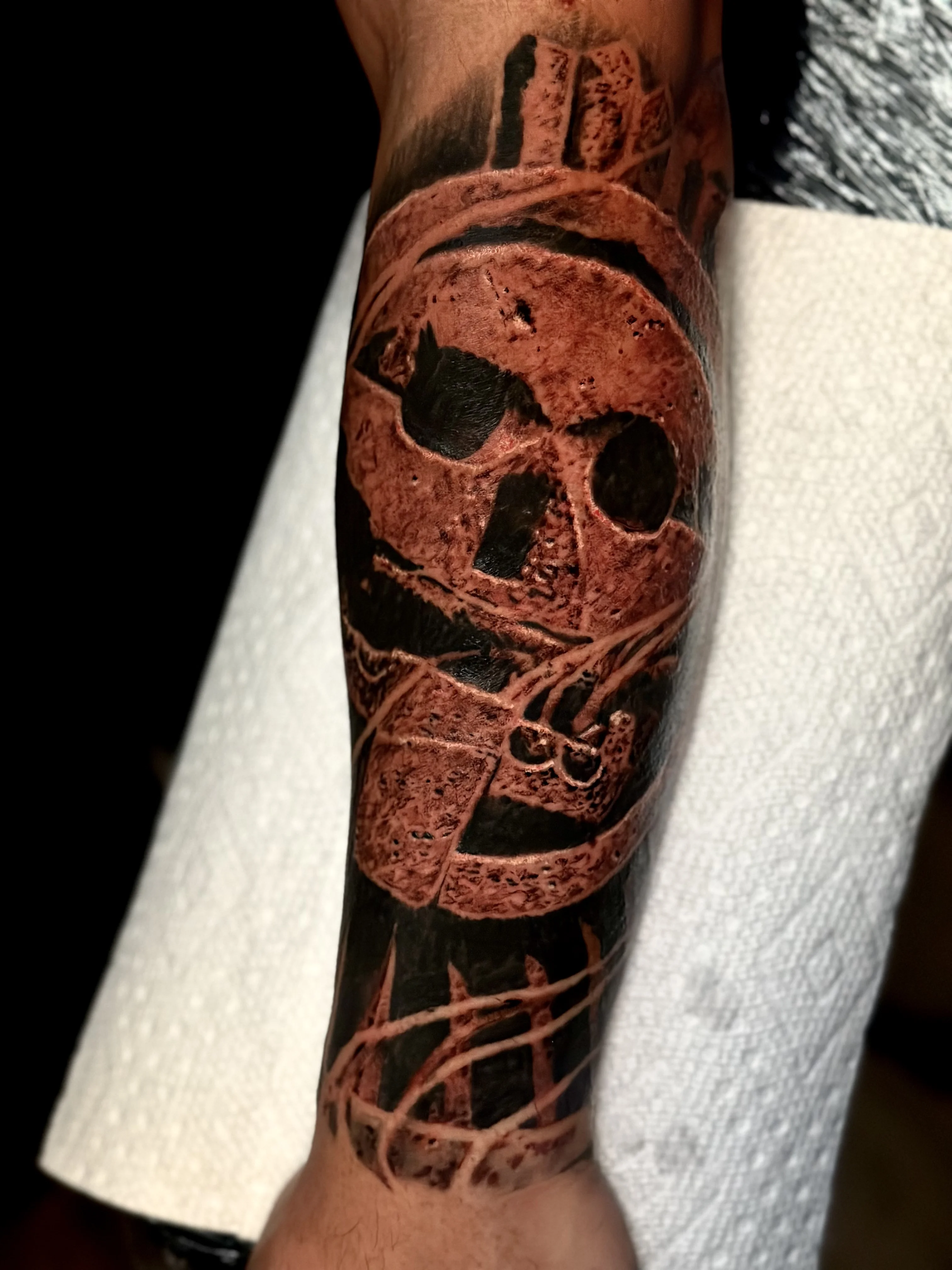 Blackwork tattoo by Danny Romeo Orellana Tat2one: skull, crossbones, bone structure, dark
