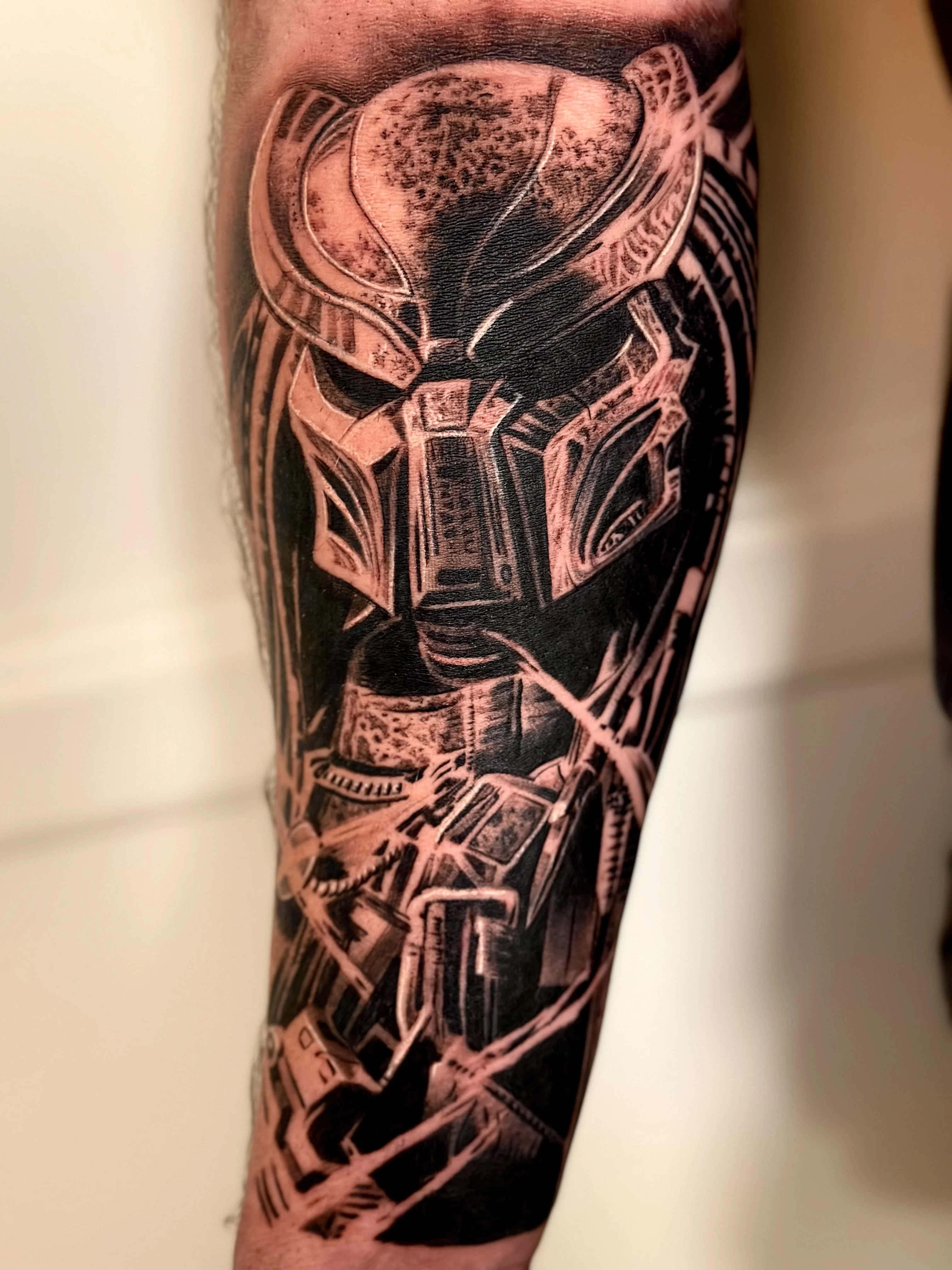 Blackwork tattoo by Danny Romeo Orellana Tat2one: robotic face, helmet, cables, mechanical components