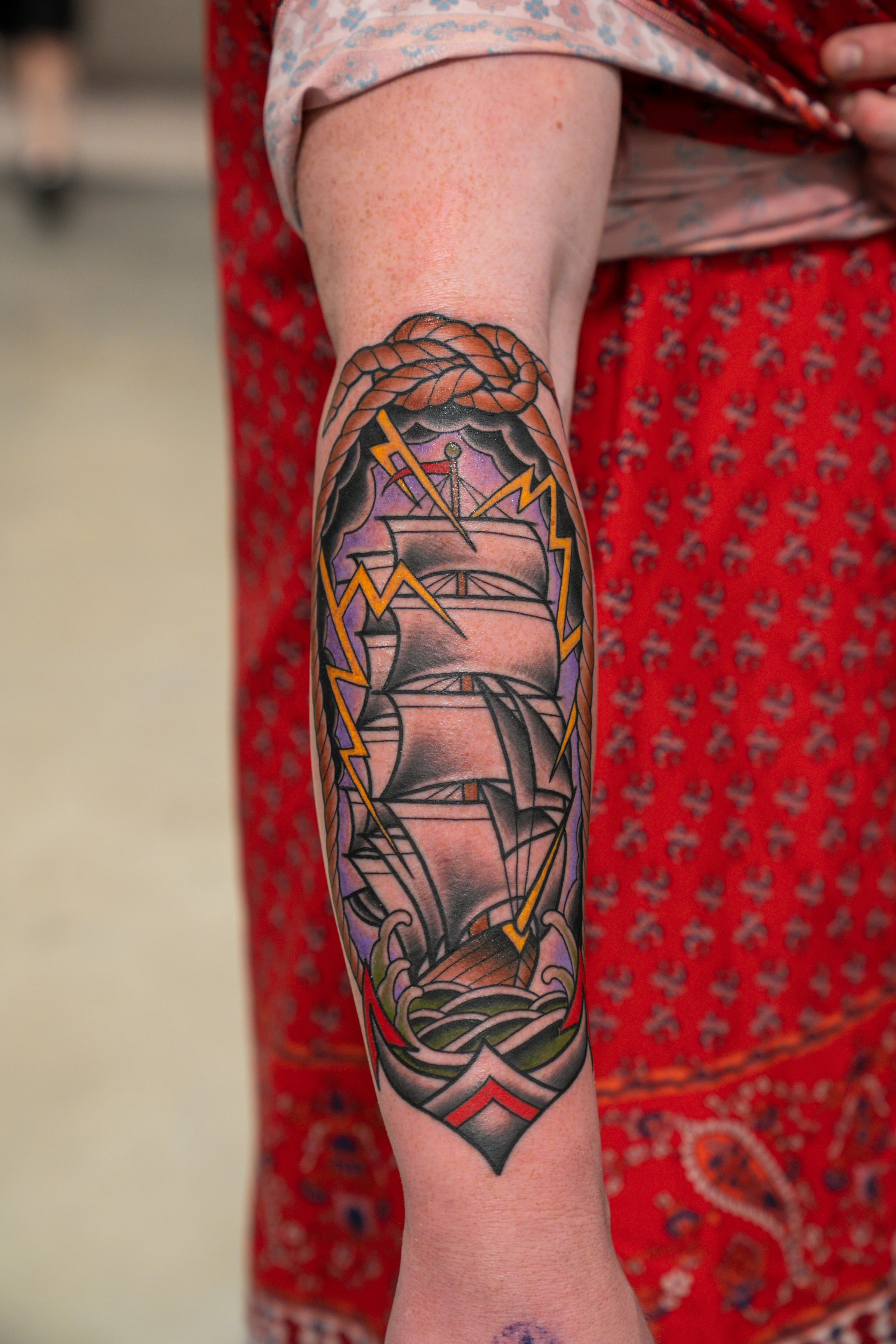 Traditional tattoo by Don Don: sailing ship, waves, rope, lightning
