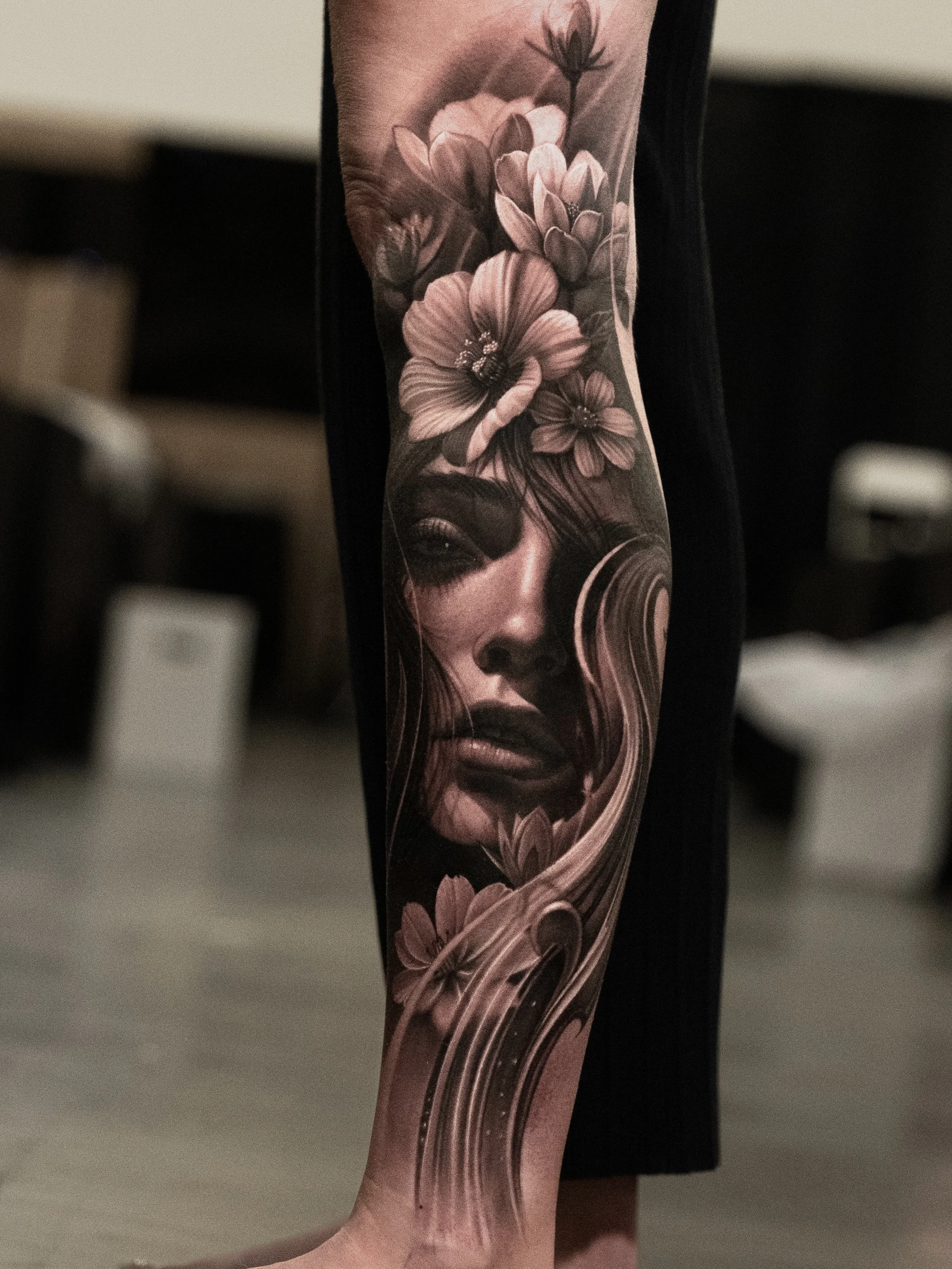 Black & Gray Realism tattoo by Gara: woman, flowers, leaves, hair