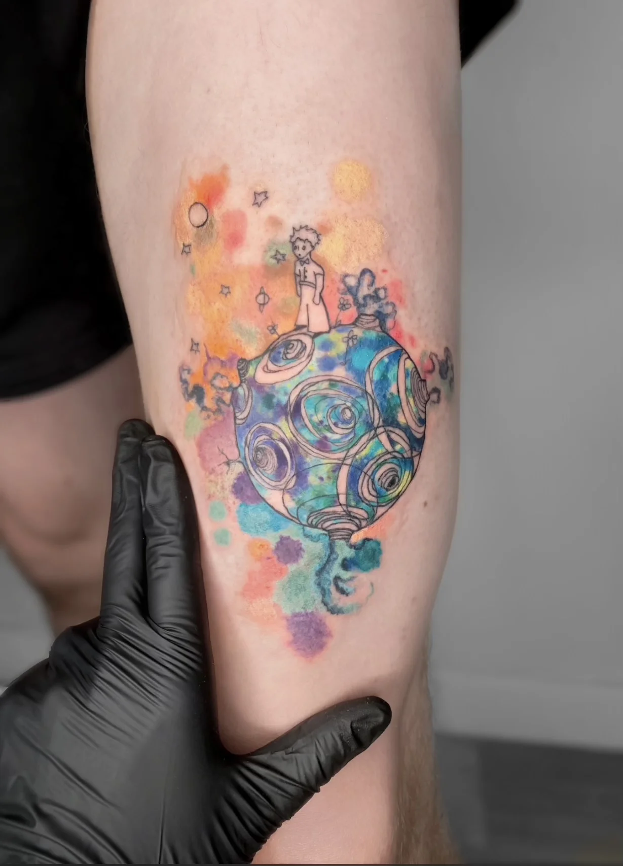 Watercolor tattoo by Nicole Petrou: small boy, the little prince, planet, stars
