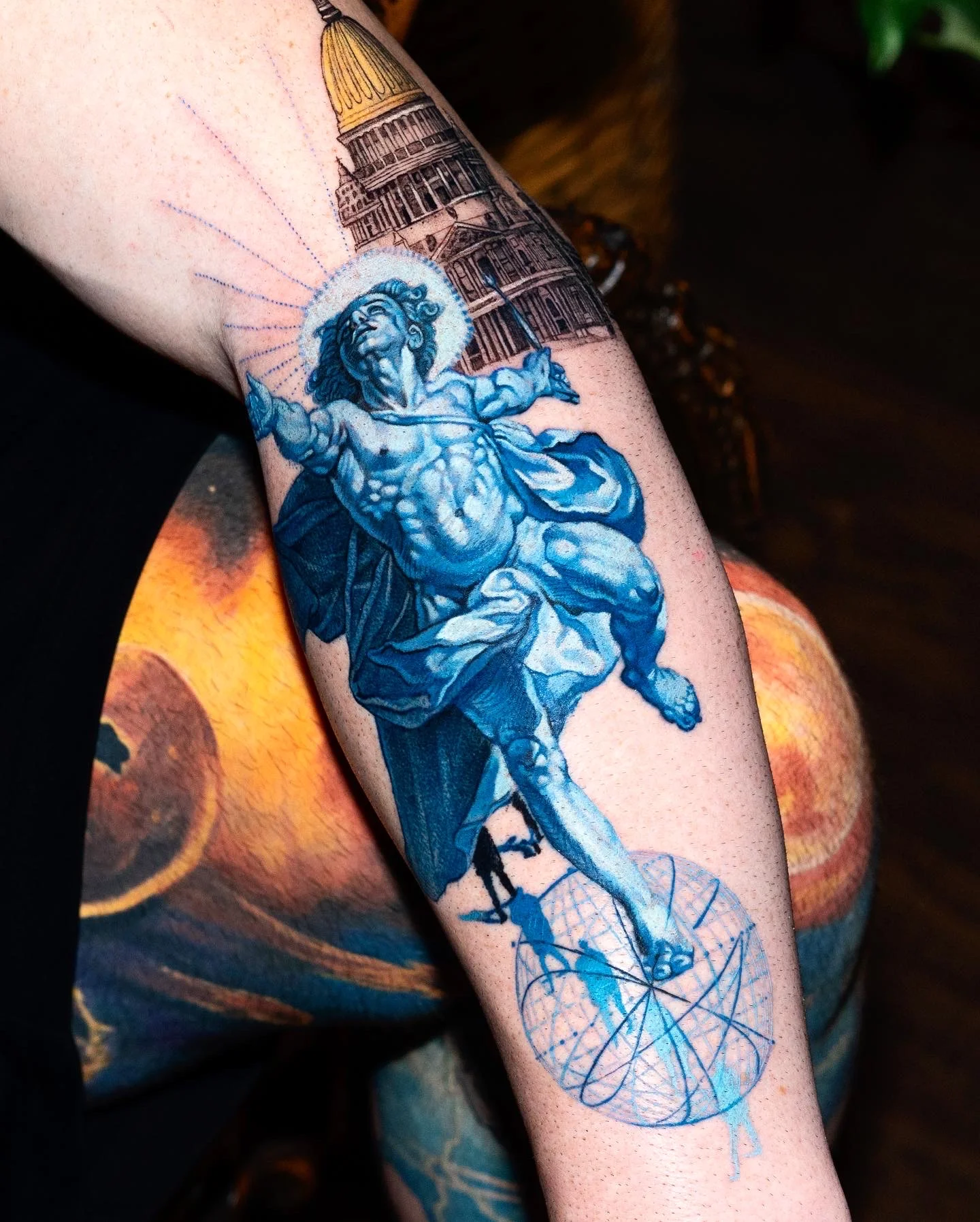 Color Realism tattoo by Q tattoo: male figure, halo, cat, building dome