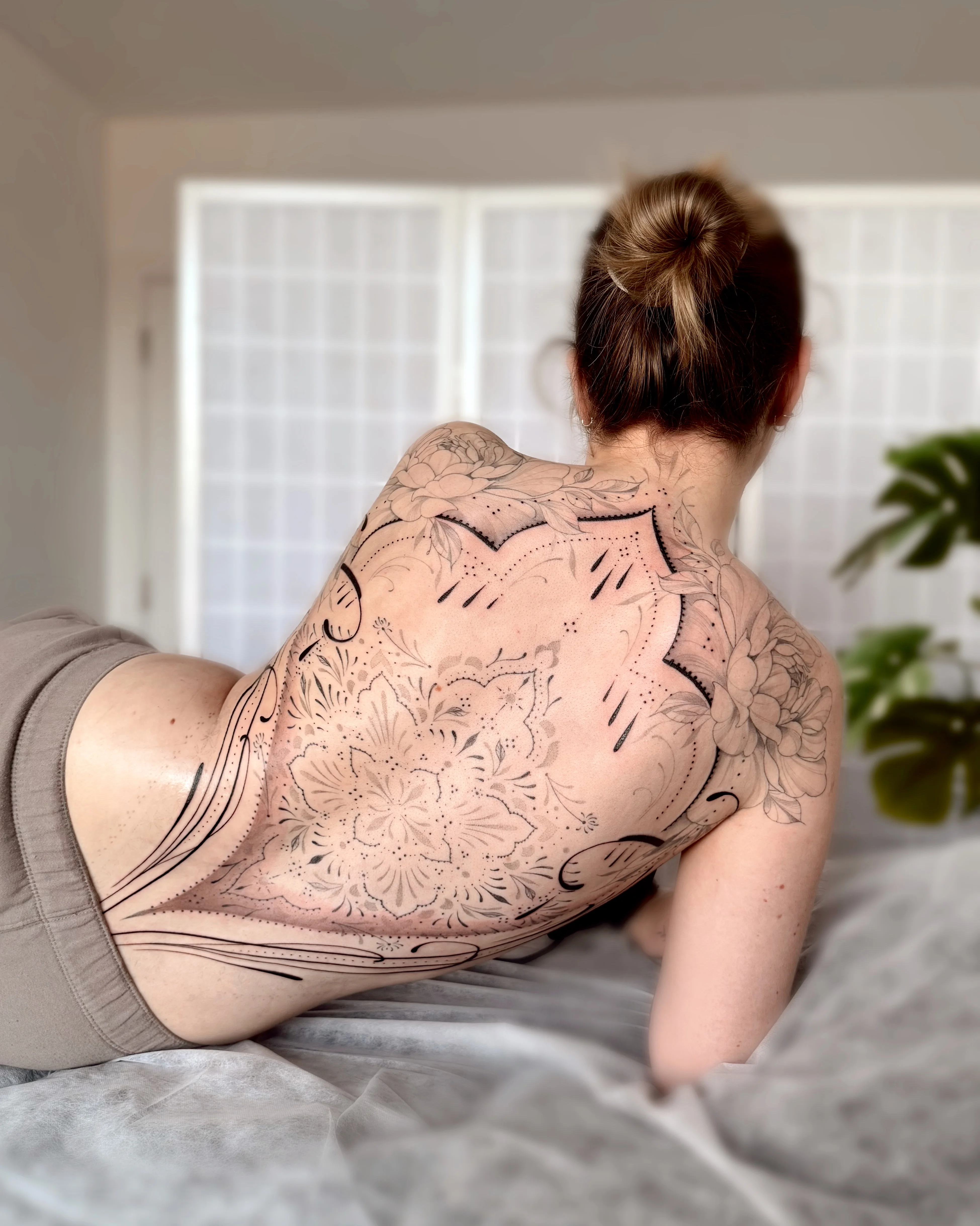 Blackwork tattoo by Abigail Louise: floral pattern, mandala, peony flowers, lace pattern
