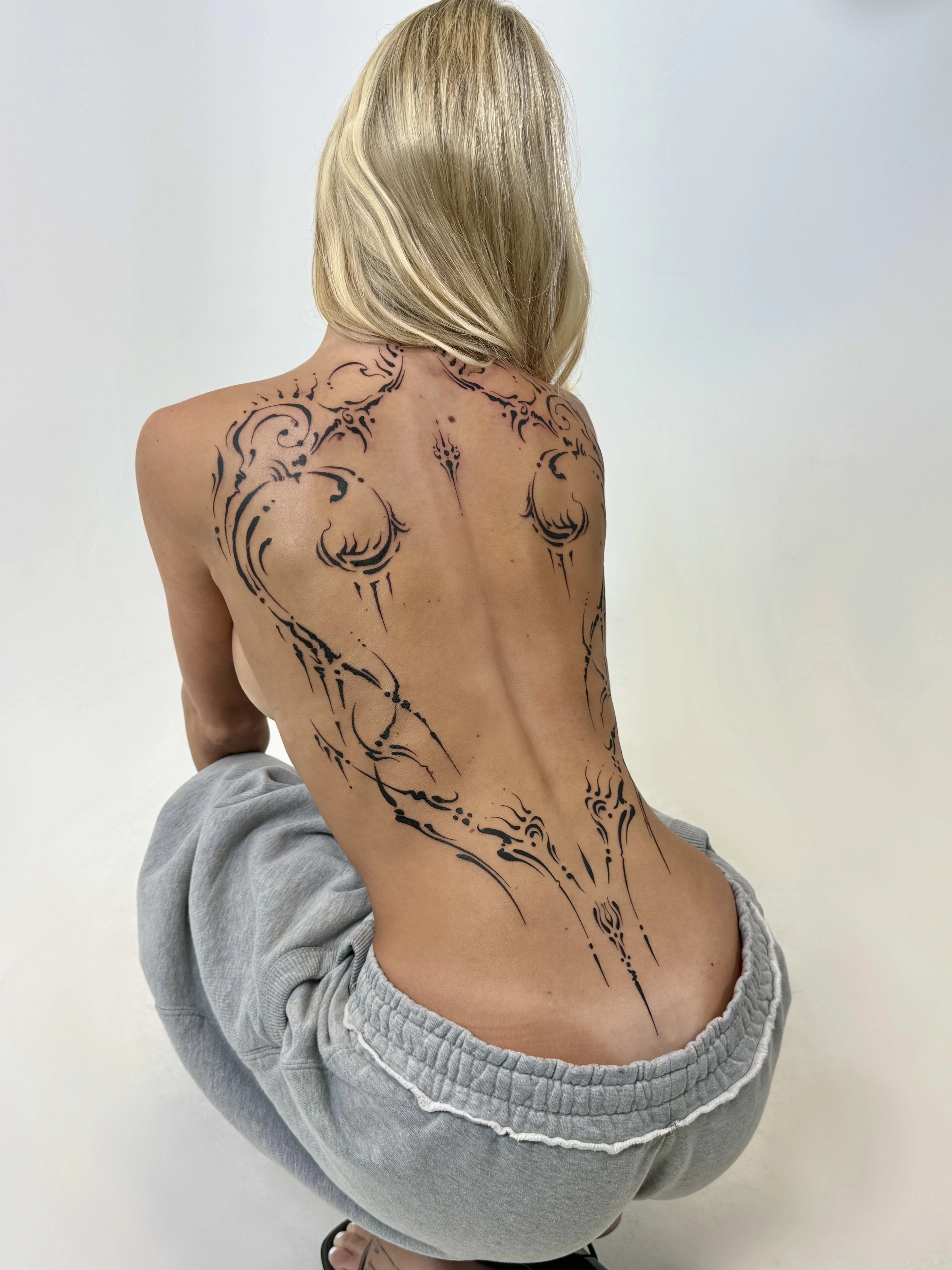 Blackwork tattoo by Abigail Louise: ornamental design, abstract filigree, decorative lines, ornamental