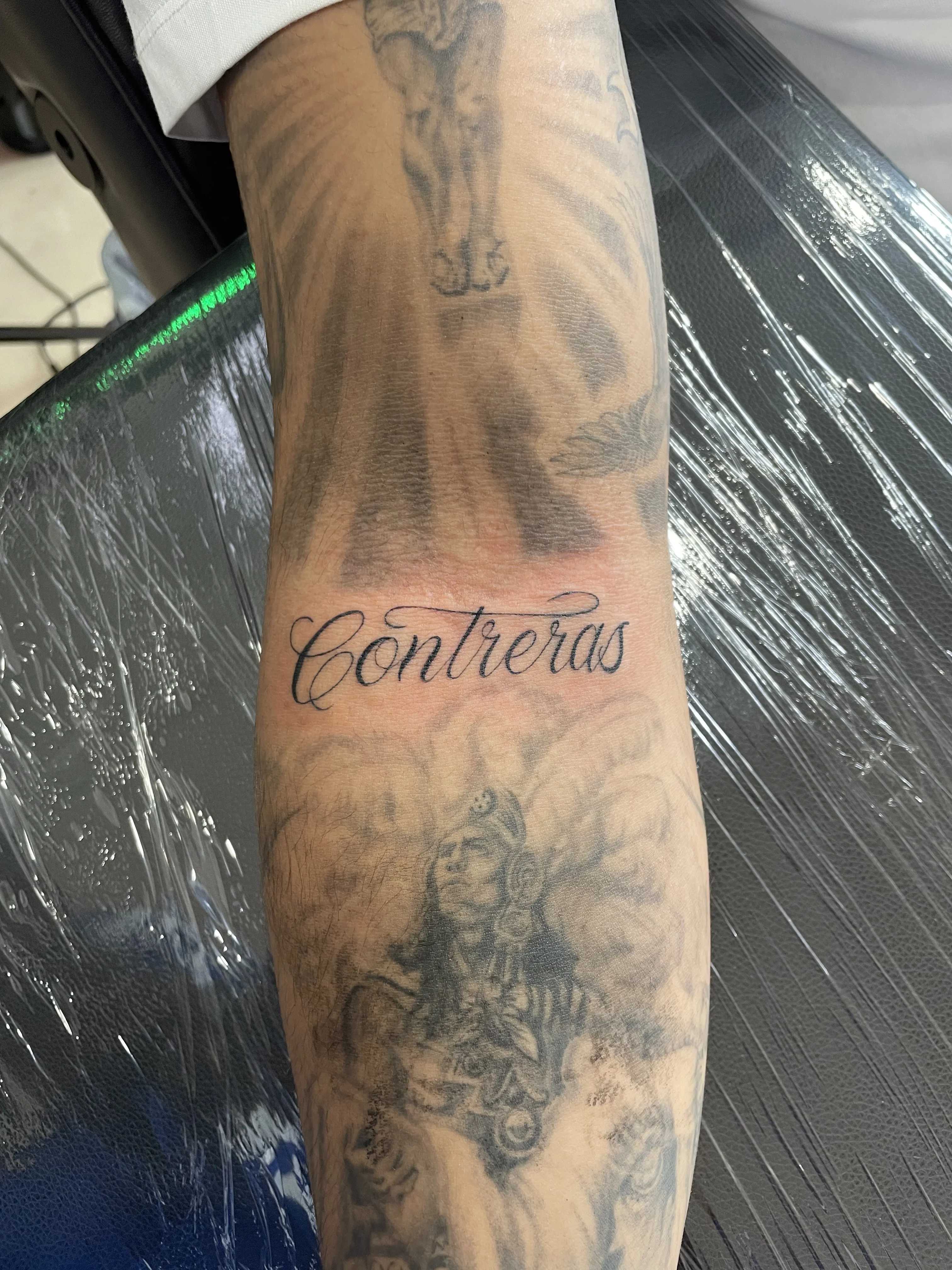 Black & Gray Realism tattoo by Jc_TheArtist: portrait of woman, headpiece, feathers, script text