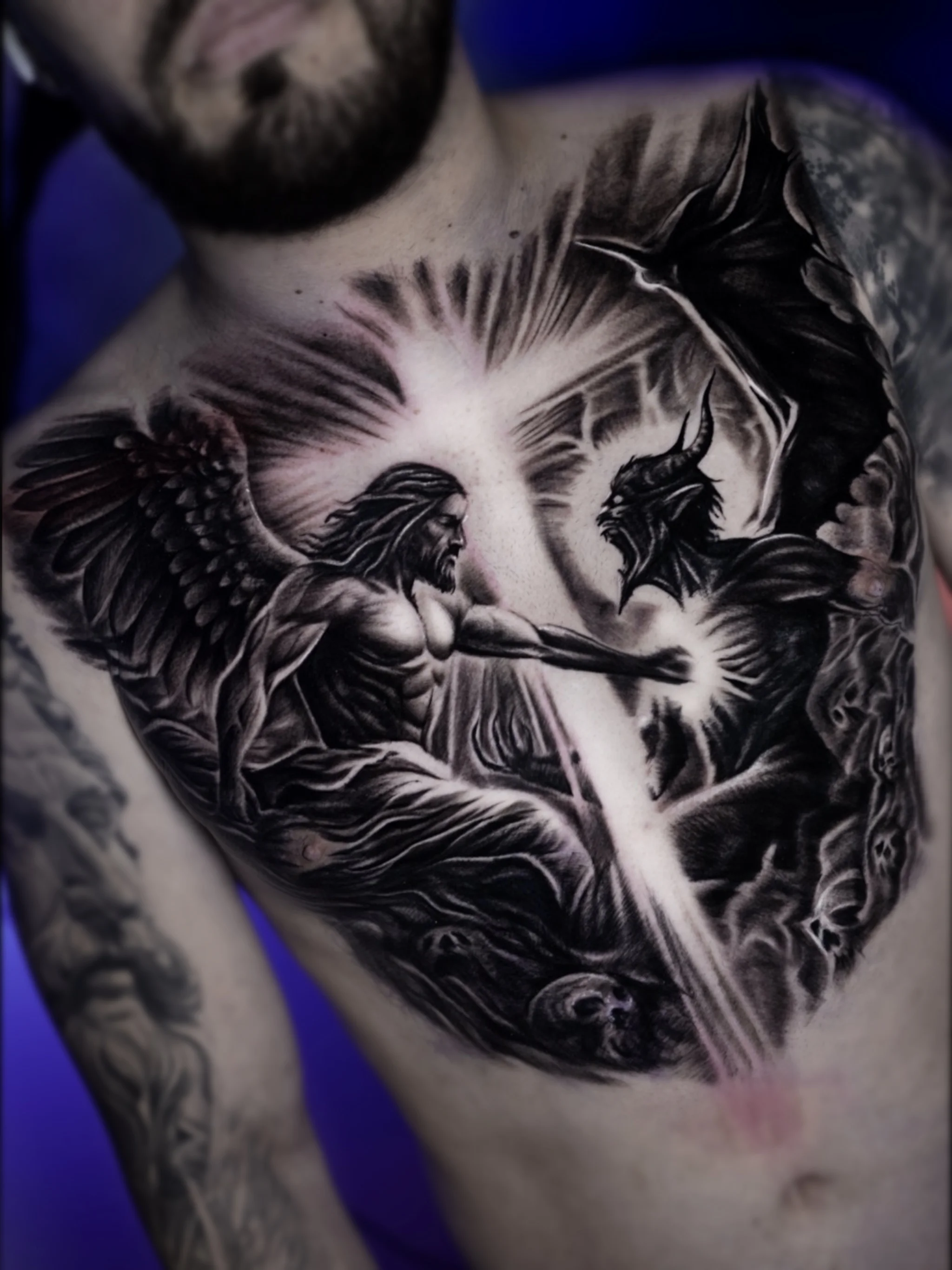 Black & Gray Realism tattoo by Arte de José Manrique: angel, demon, wings, horns