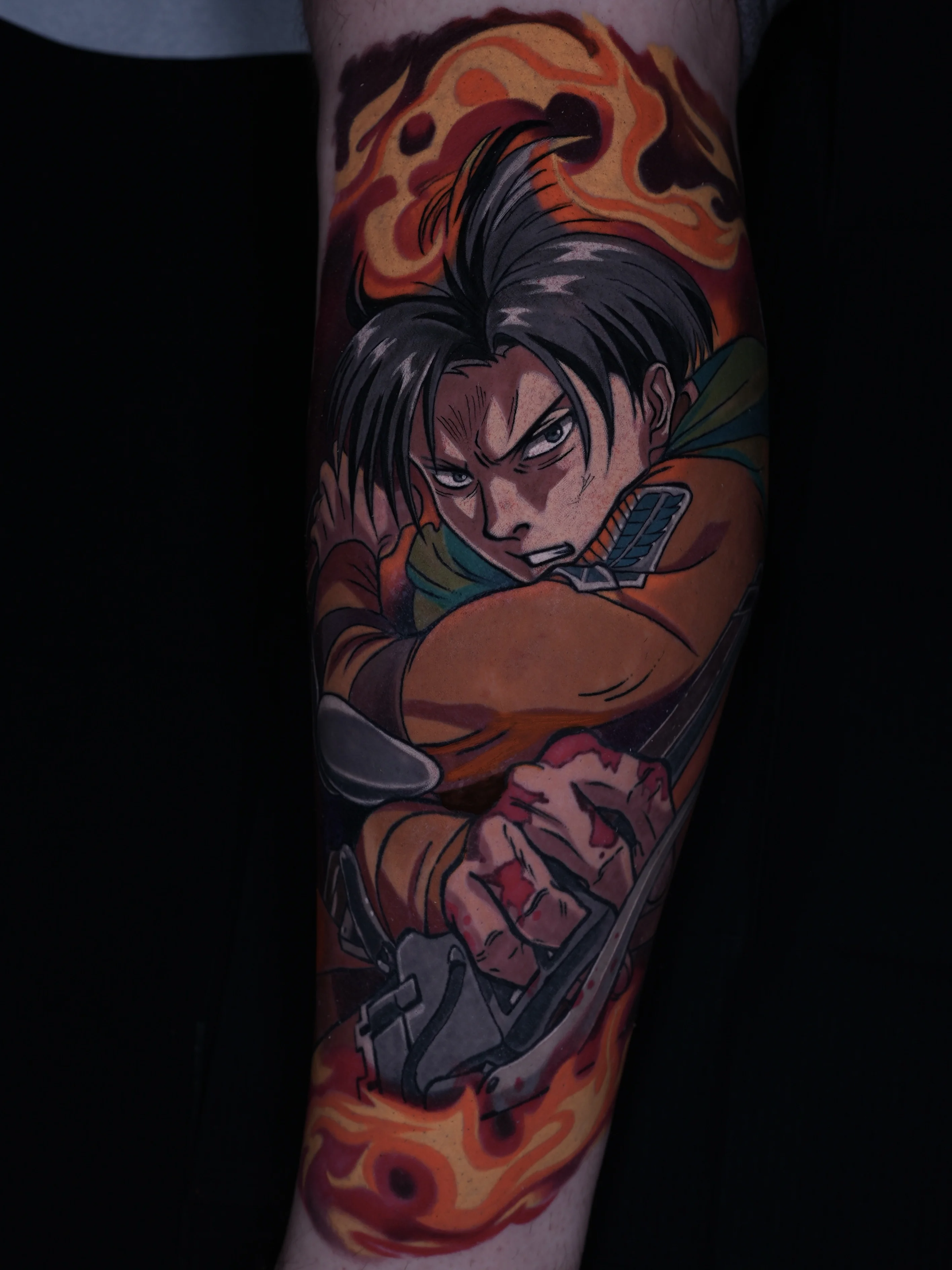 Anime tattoo by GABRIEL FUERZAS INK/ANIME TATTOOS DENVER: male anime character, fire, hand, armor