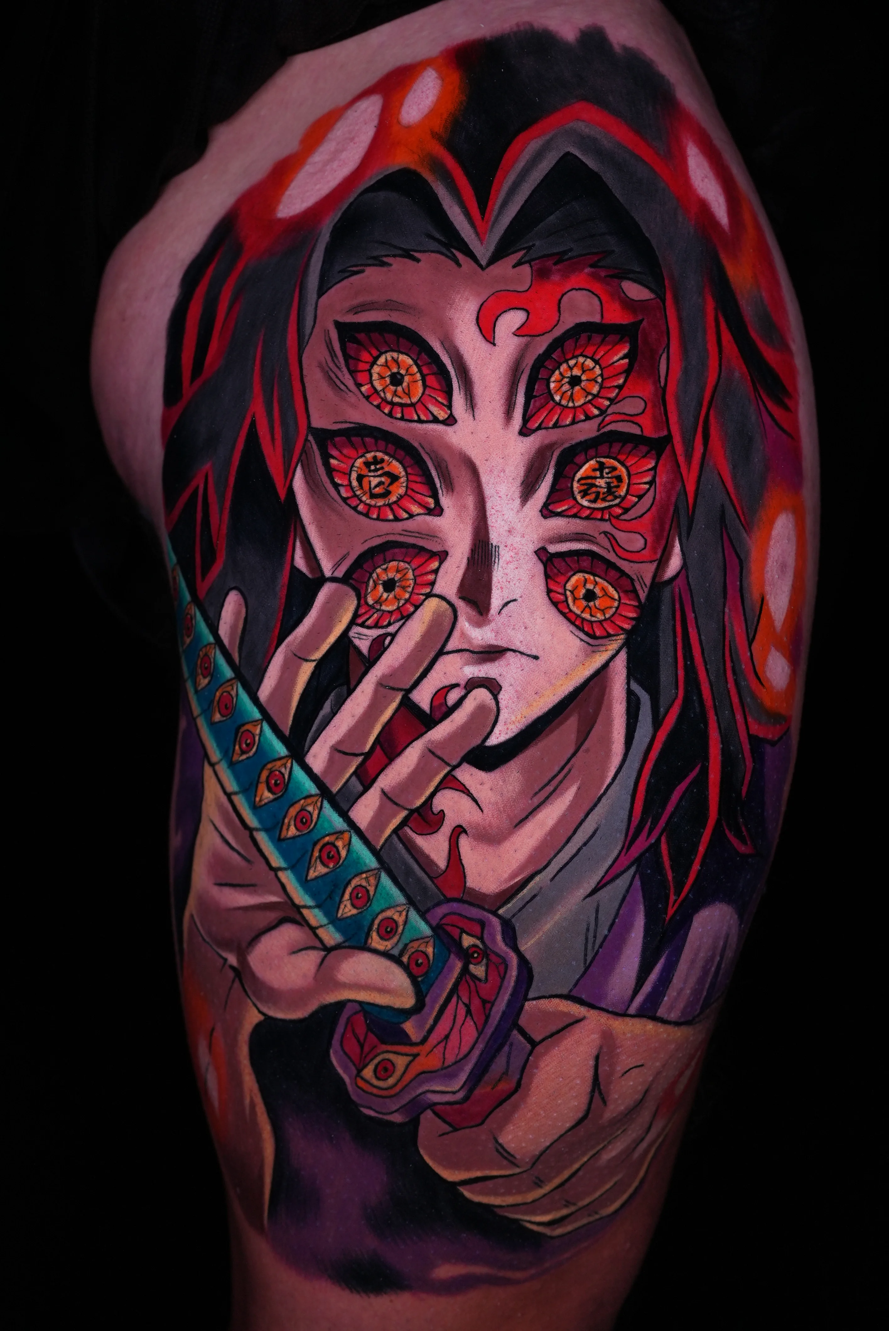 Anime tattoo by GABRIEL FUERZAS INK/ANIME TATTOOS DENVER: anime character, multiple eyes, sword, hand