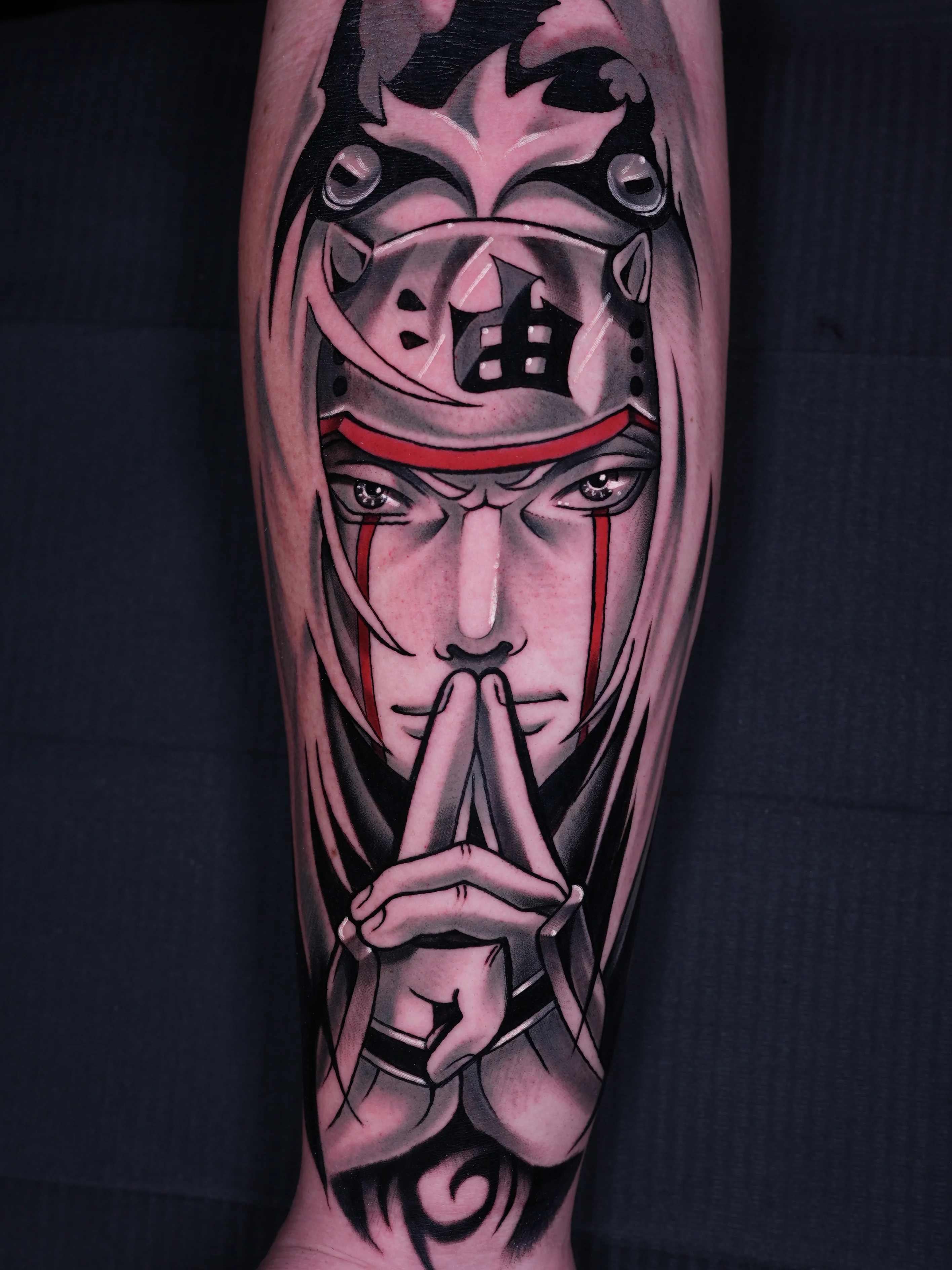 Anime tattoo by GABRIEL FUERZAS INK/ANIME TATTOOS DENVER: male character, hand gesture, headband, hood