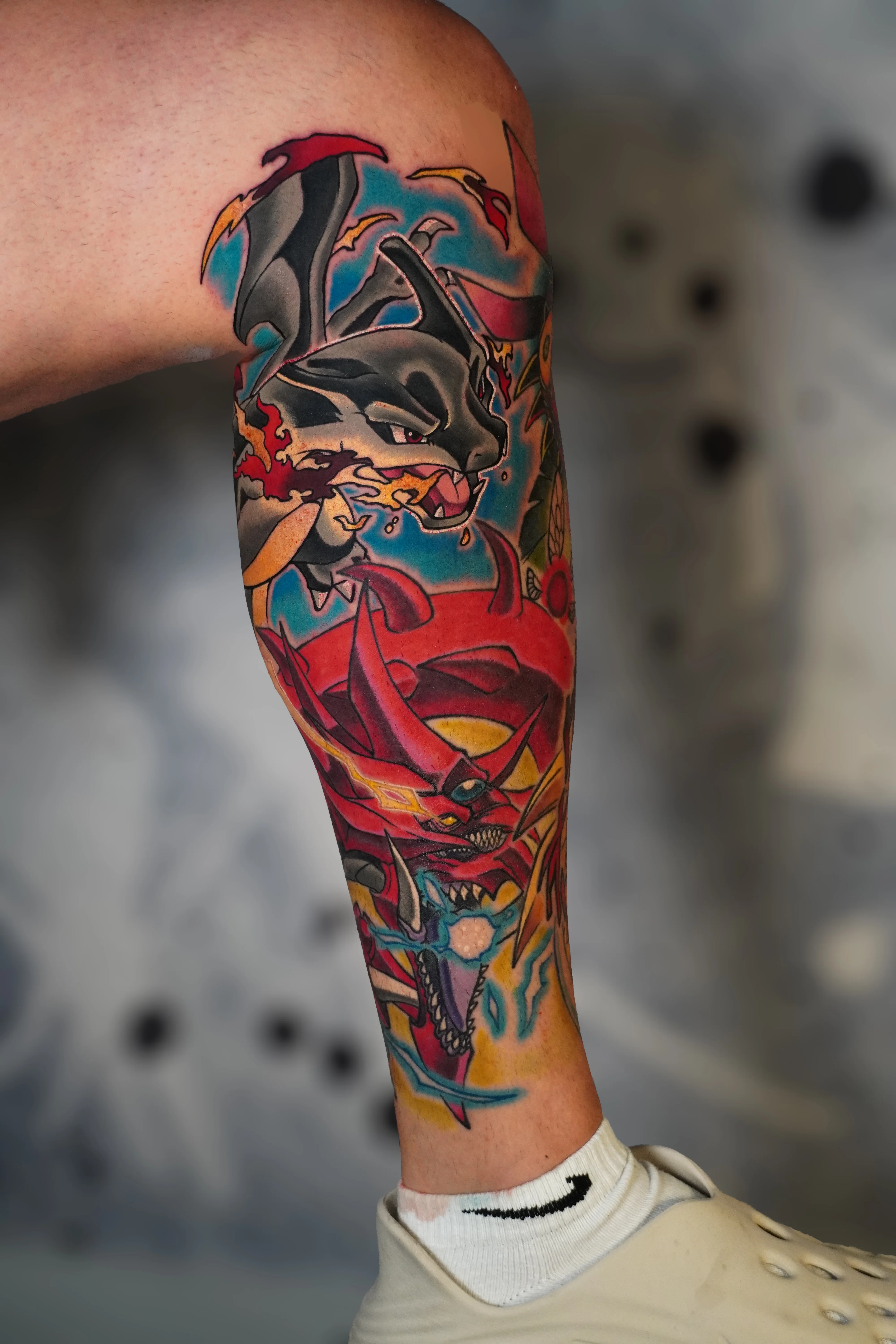 New School tattoo by Bobby Hulsey: black panther, fire, red demon, dragon