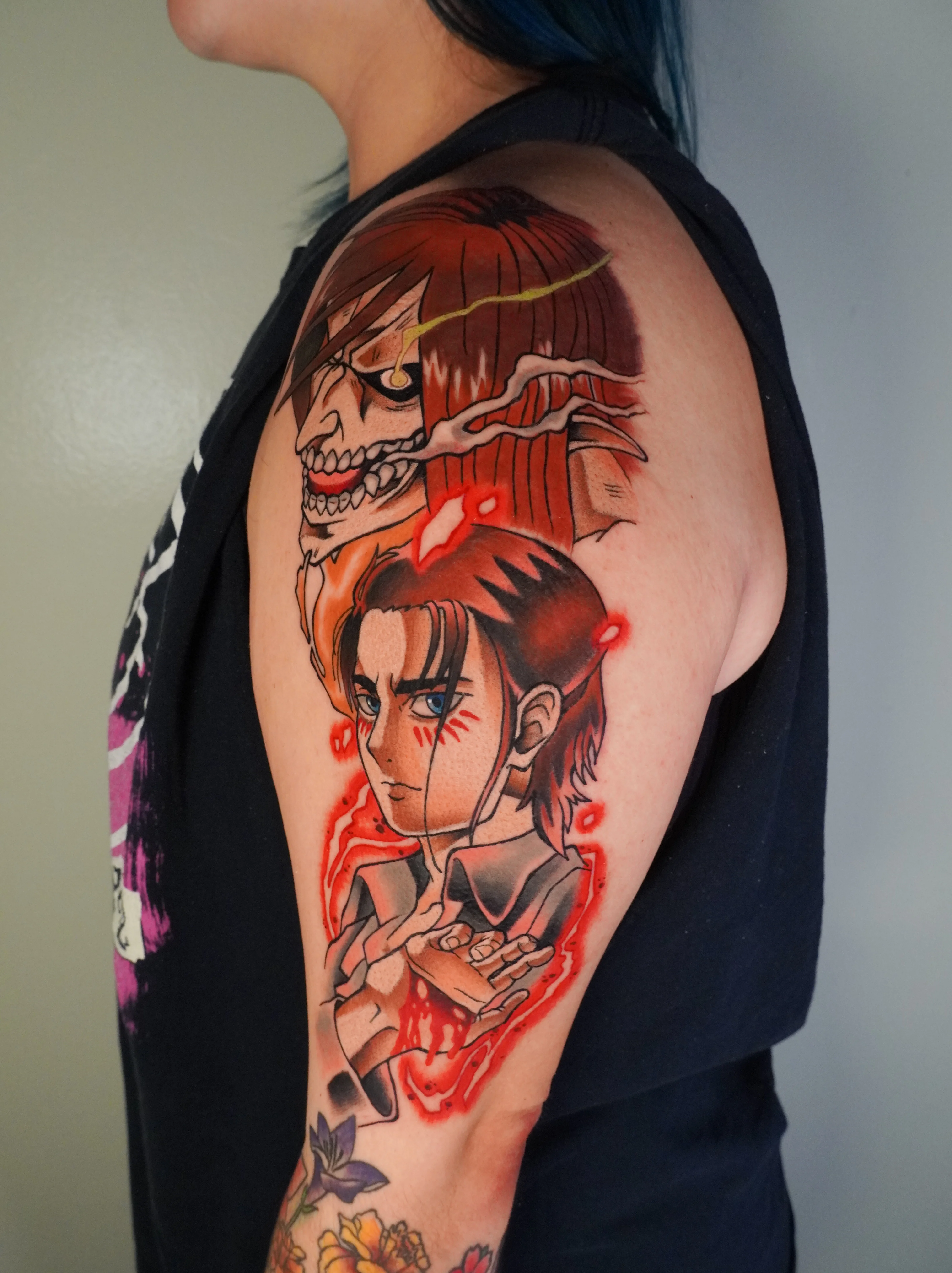 Anime tattoo by Bobby Hulsey: human face, demon face, red aura, blue eyes