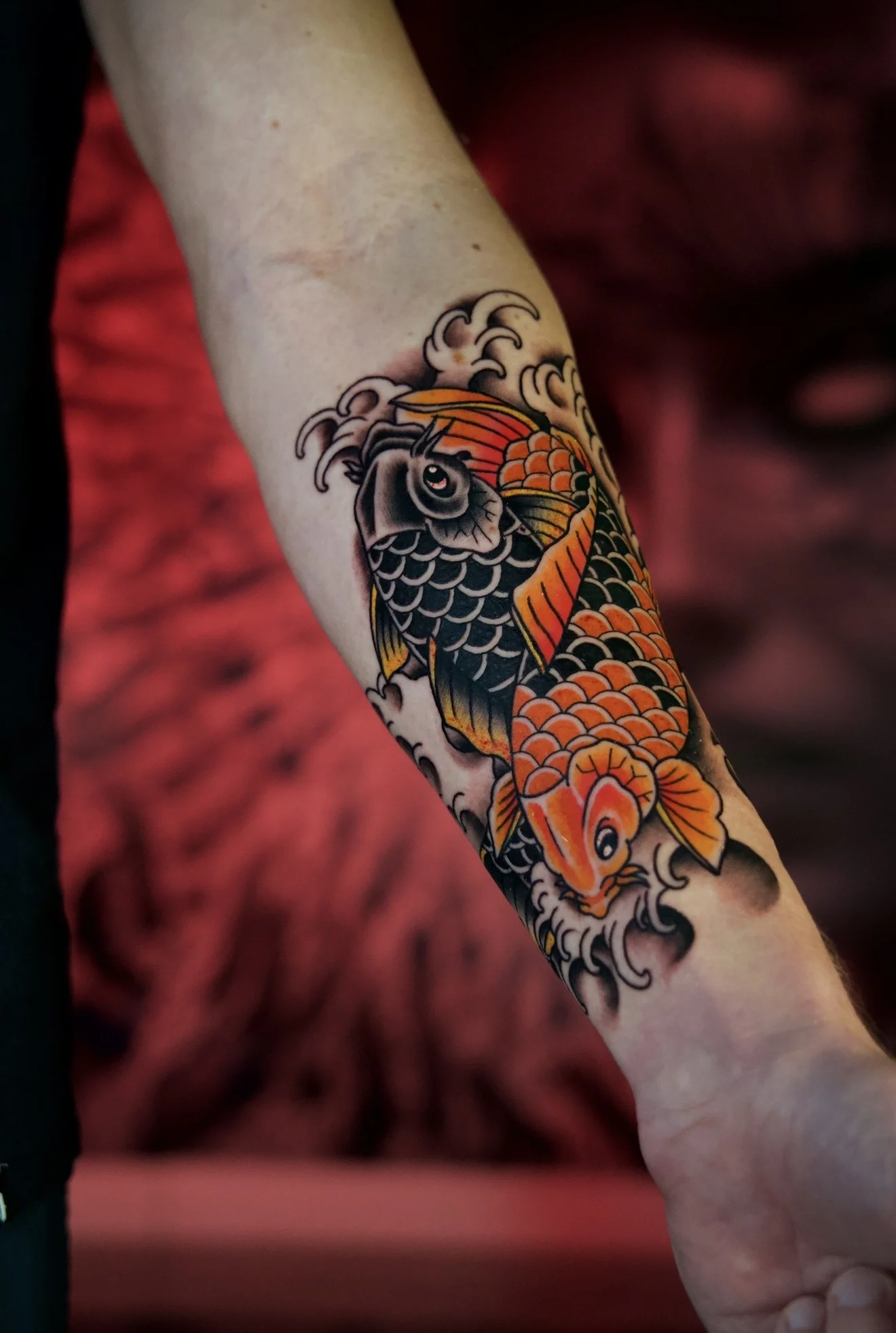 Traditional tattoo by Bobby Hulsey: koi fish, water waves, animal, nature