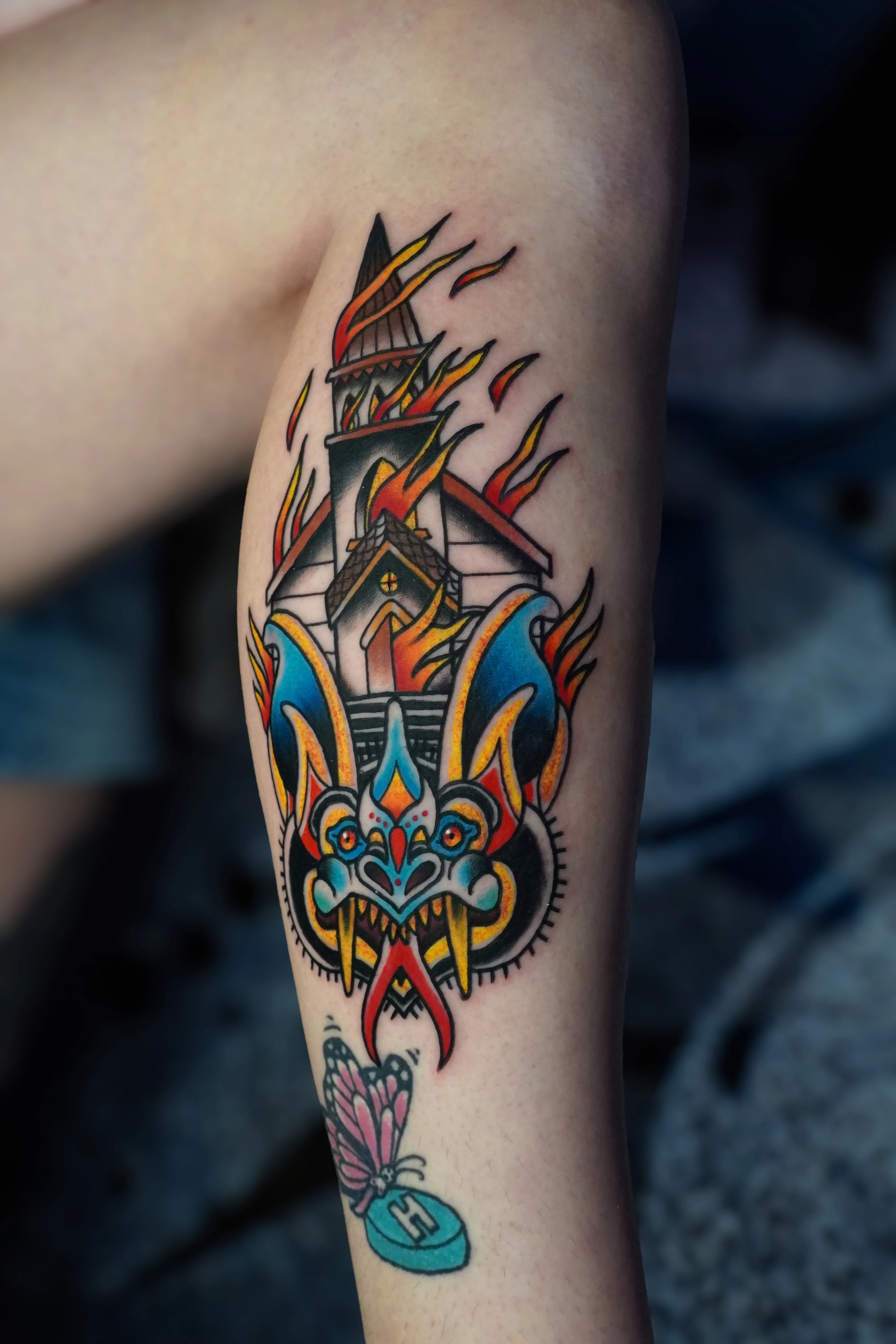 Traditional tattoo by Bobby Hulsey: church, bat, flames, cross