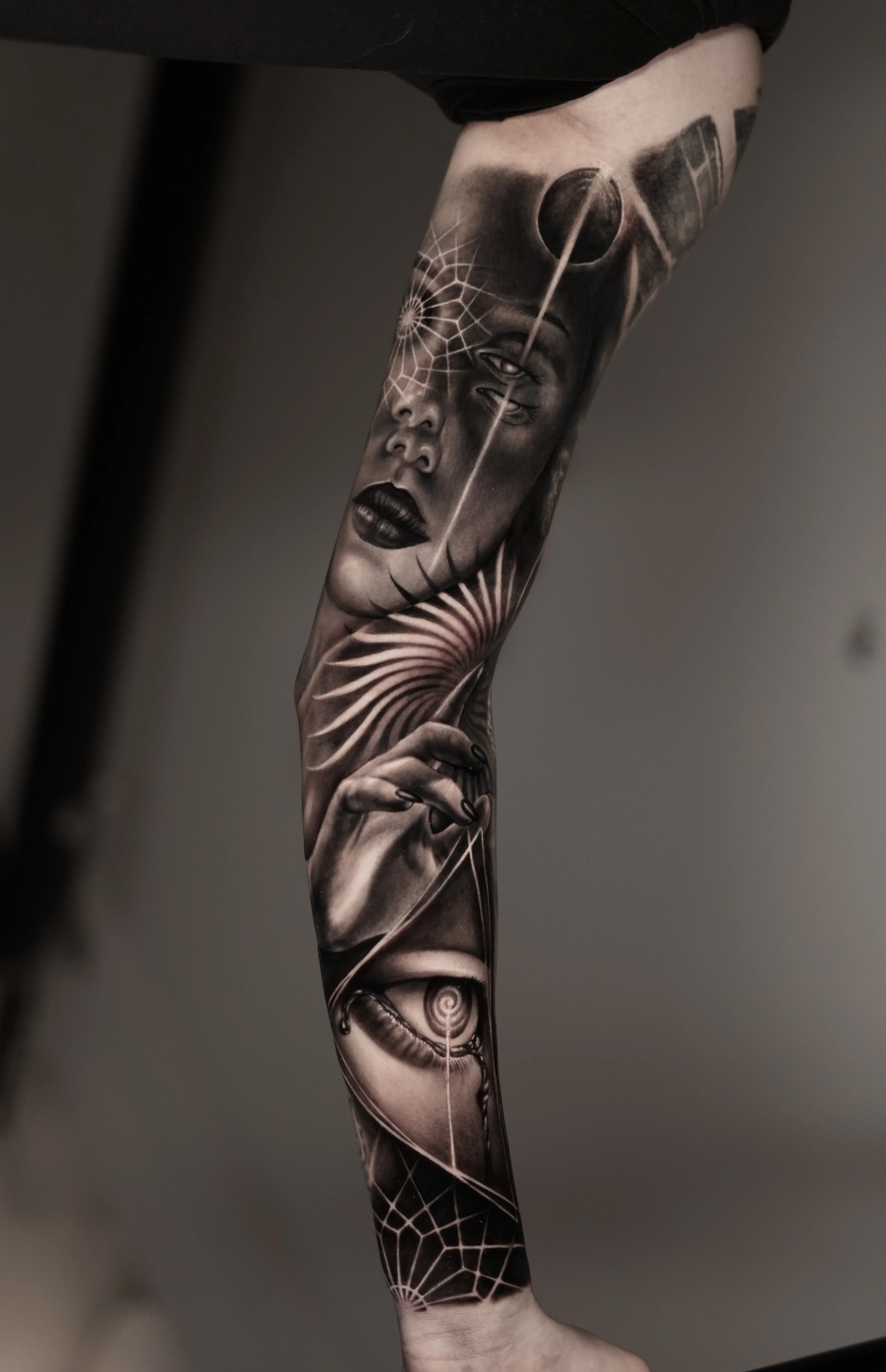 Black & Gray Realism tattoo by Camilo Gonzalez: woman, eye, hand, spider web