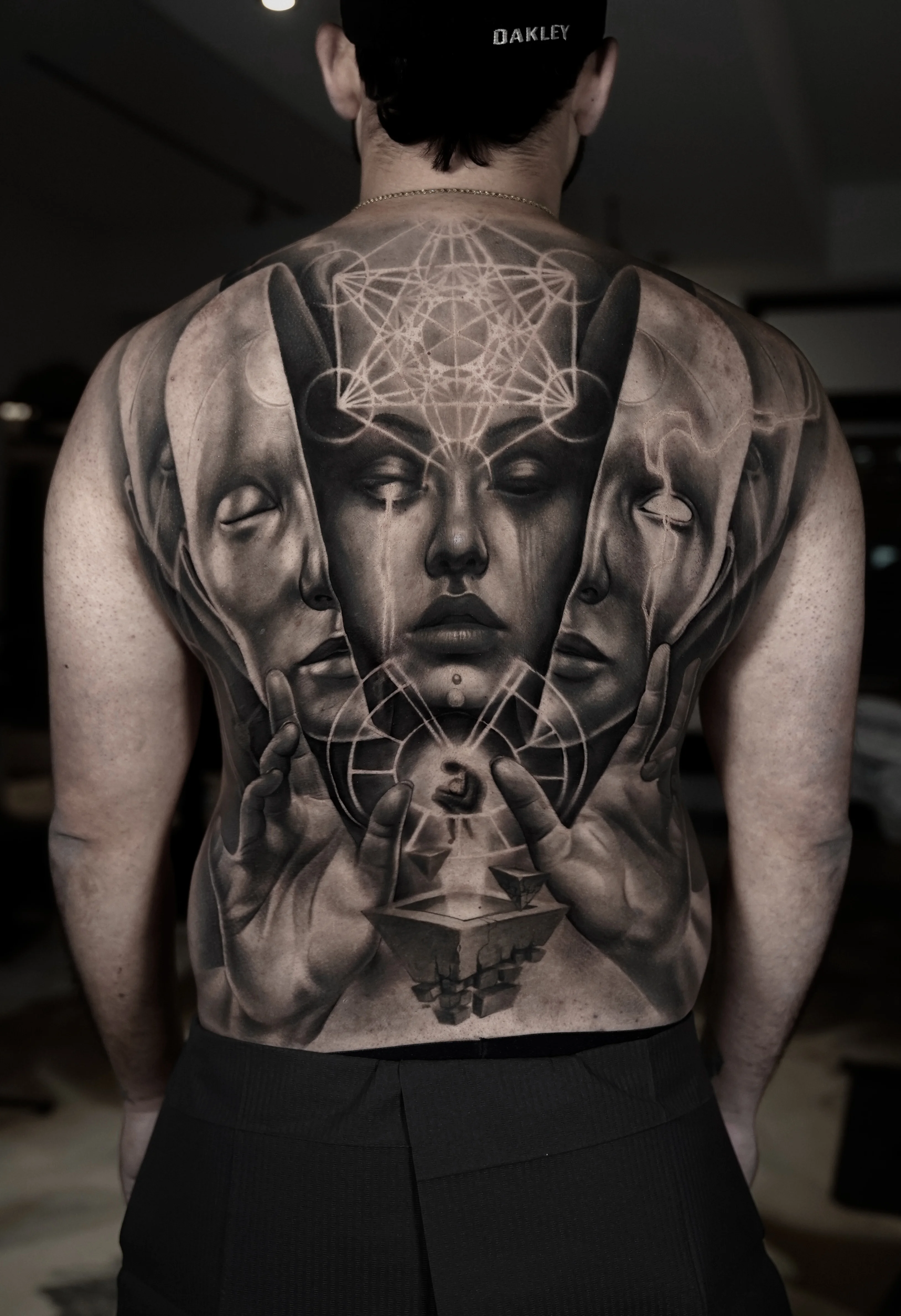 Black & Gray Realism tattoo by Camilo Gonzalez: woman face, two side profiles, hands, geometric pattern