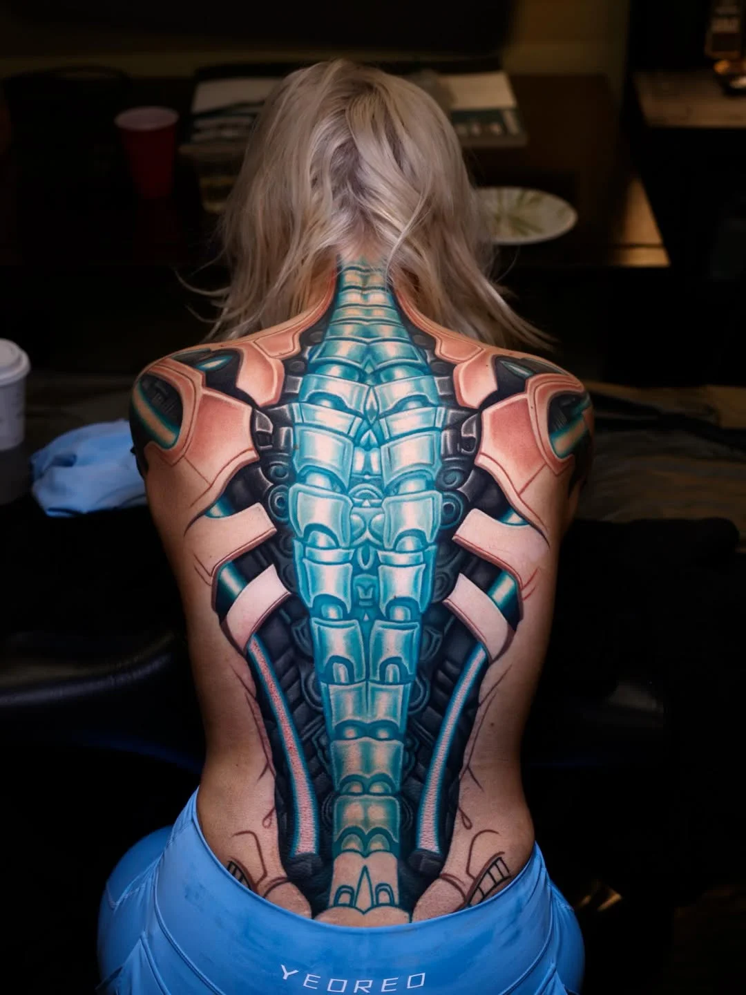 Biomechanical tattoo by Nikko Hurtado: mechanical spine, robotic components, metal plates, circuit-like patterns