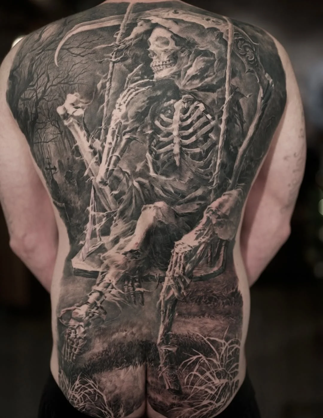Black & Gray Realism tattoo by Carlos Torres: skeleton, scythe, swing, trees