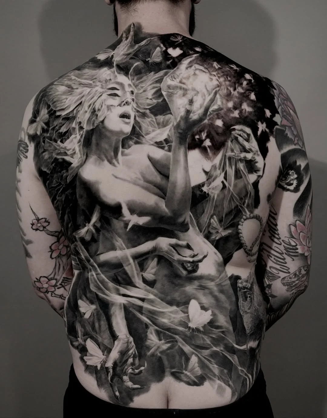 Black & Gray Realism tattoo by Carlos Torres: woman, butterflies, leaves, flowers