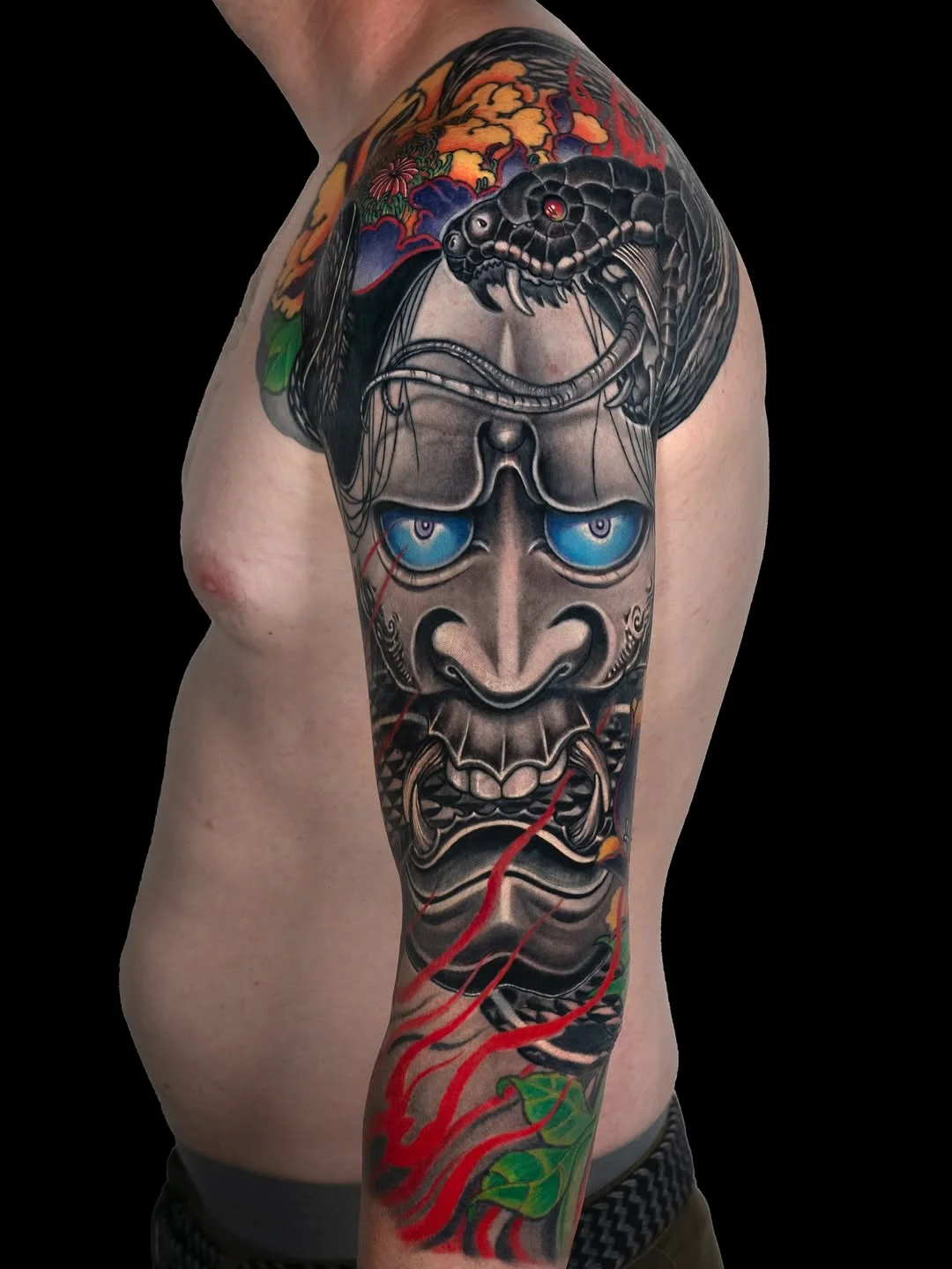 Neo-Traditional tattoo by Jess Yen: mask, snake, fangs, teeth