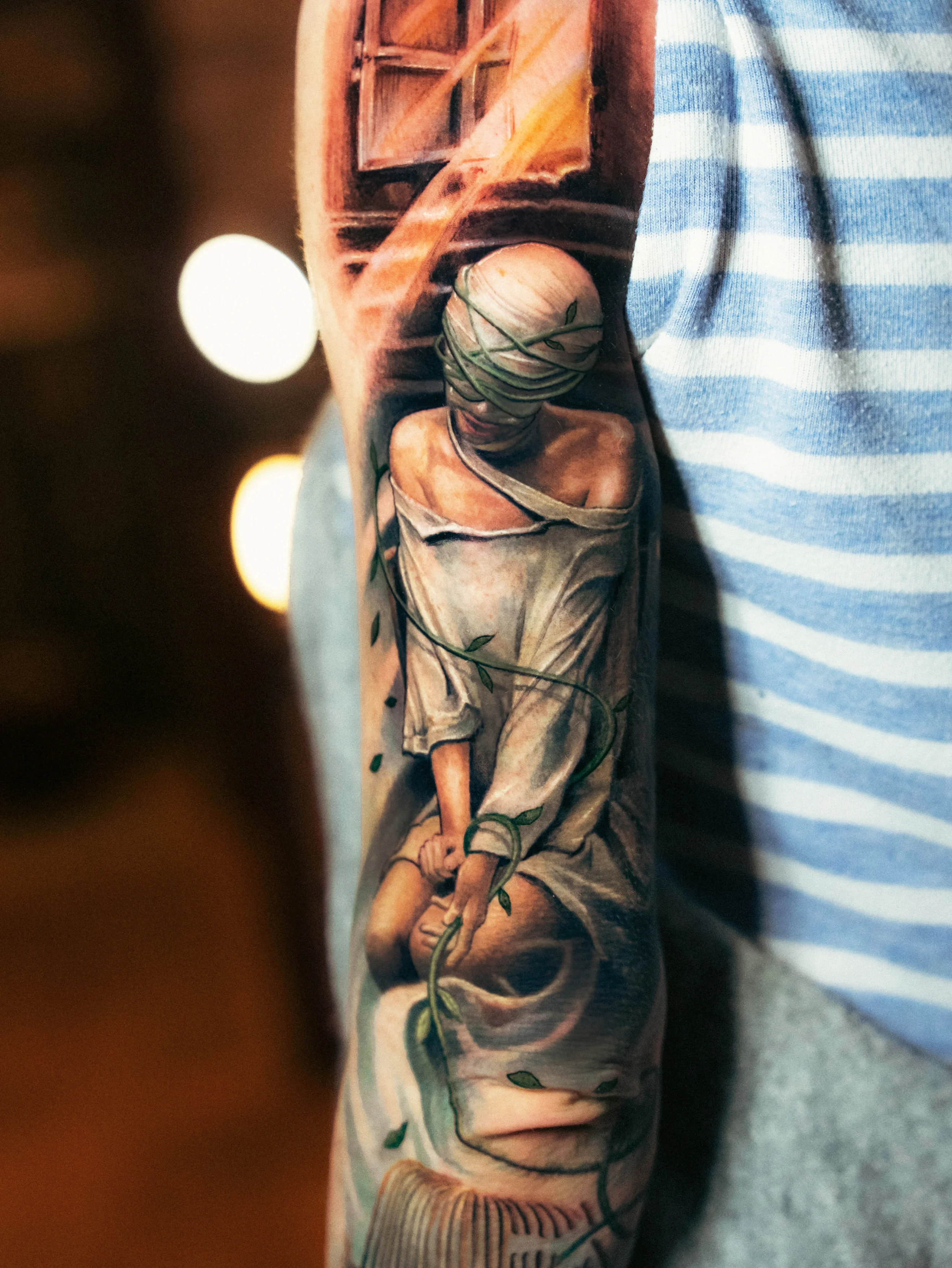 Color Realism tattoo by Yomico Moreno: woman, bandages, window, vine