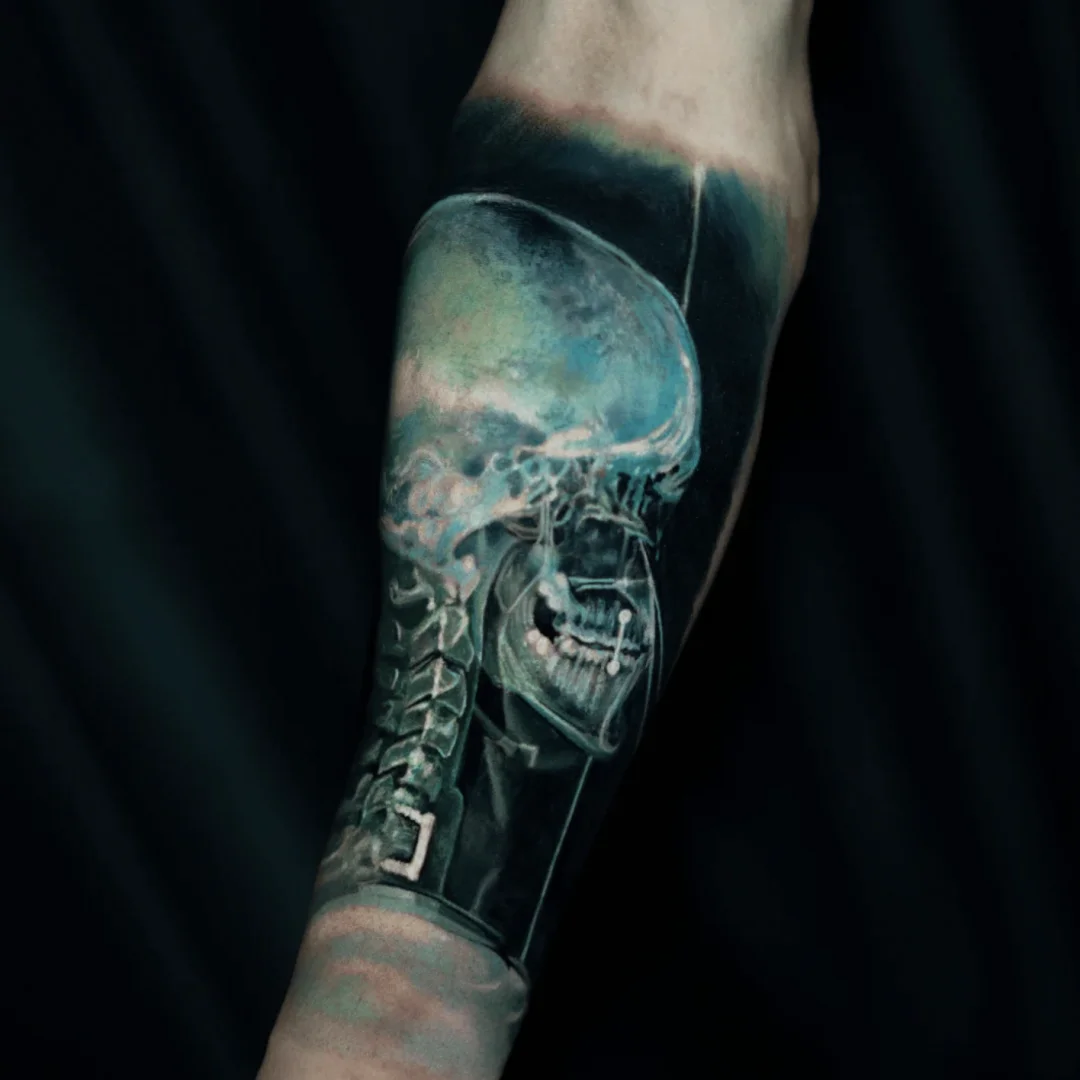 Black & Gray Realism tattoo by Yomico Moreno: skull, spine, neck vertebrae, jaw