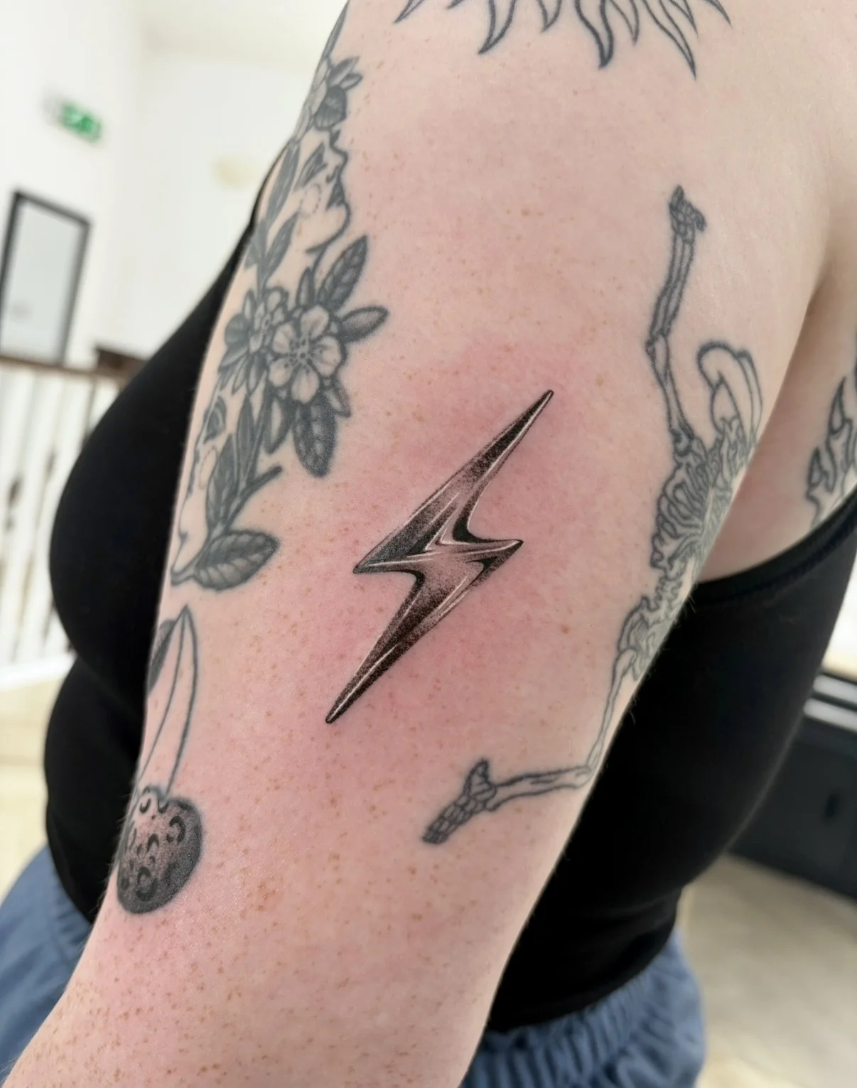 Minimal Lightning Bolt Fine Line Upper Arm: lightning bolt, flowers, skeleton, nature, dark, minimal