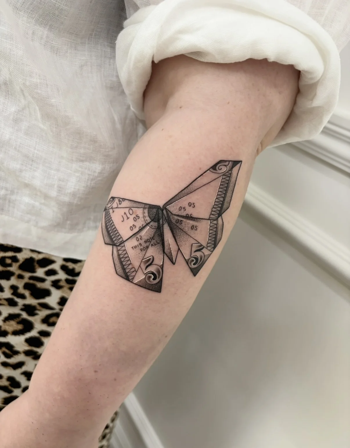 Fine Line tattoo by Aliye Gaygusuz: butterfly, numbers, geometric shapes, nature