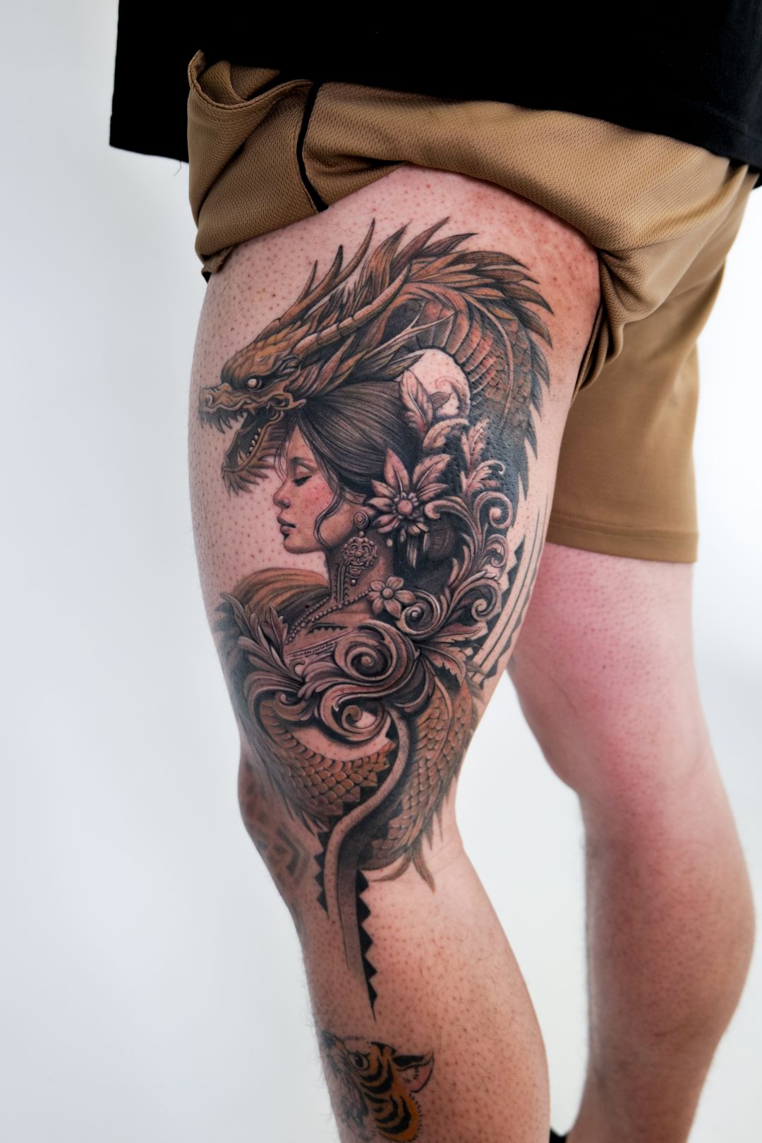 Black & Gray Realism tattoo by Sherri Anne Austria: dragon, woman, flower, ornamental pattern
