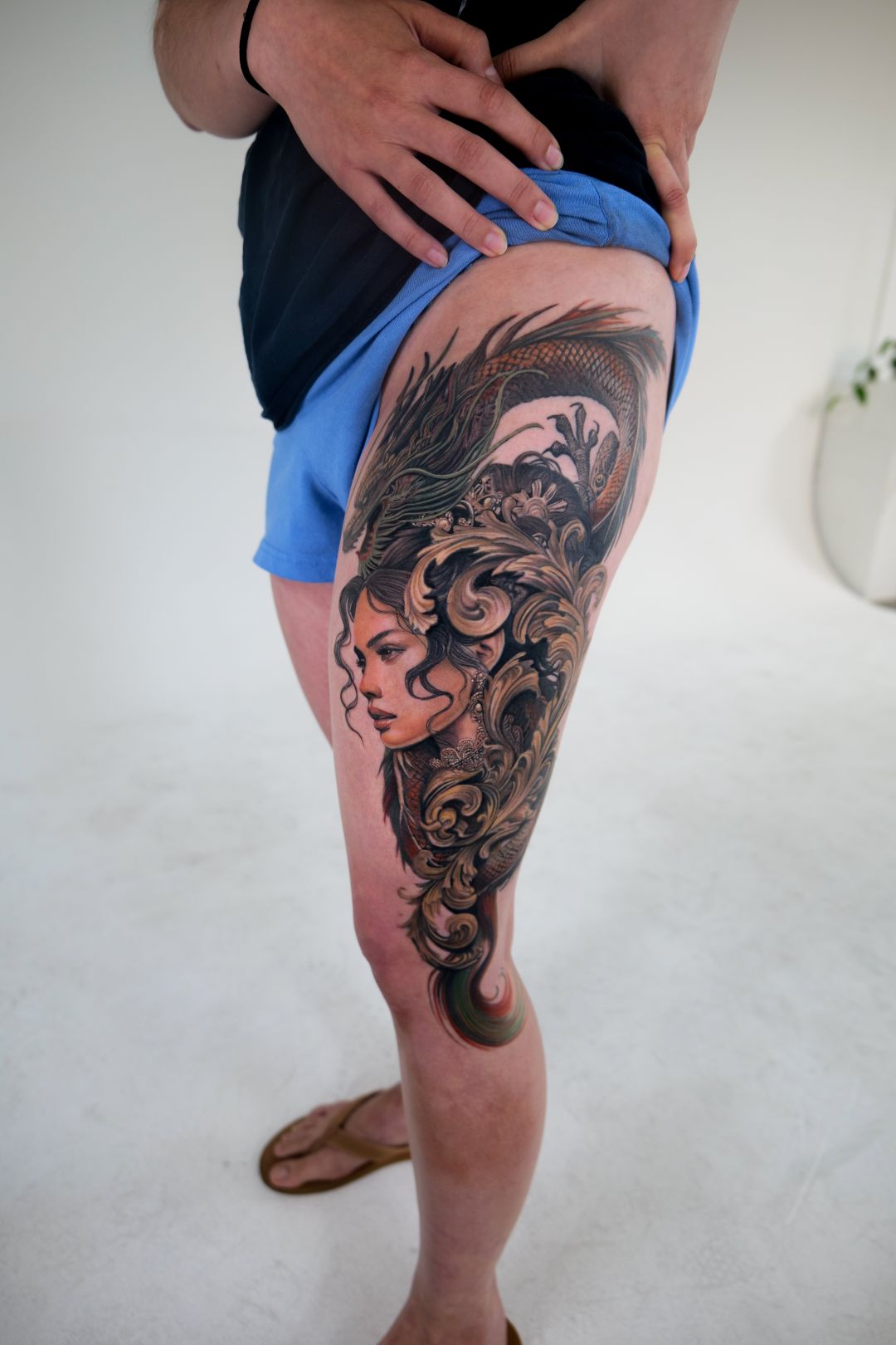 Color Realism tattoo by Sherri Anne Austria: woman, dragon, ornamental scrolls, mythology