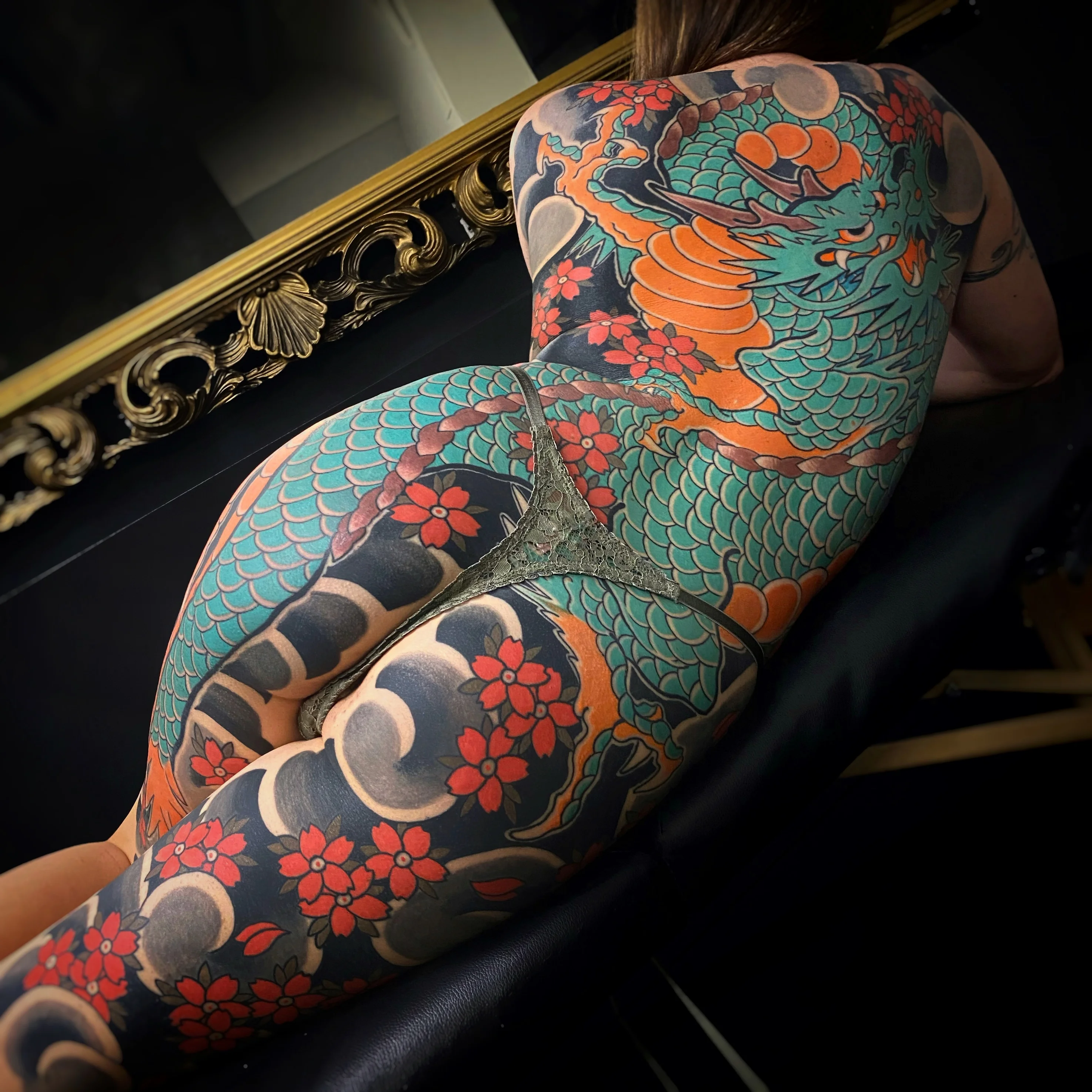 Japanese tattoo by Alessio Ventimiglia: dragon, flowers, scales, mythology