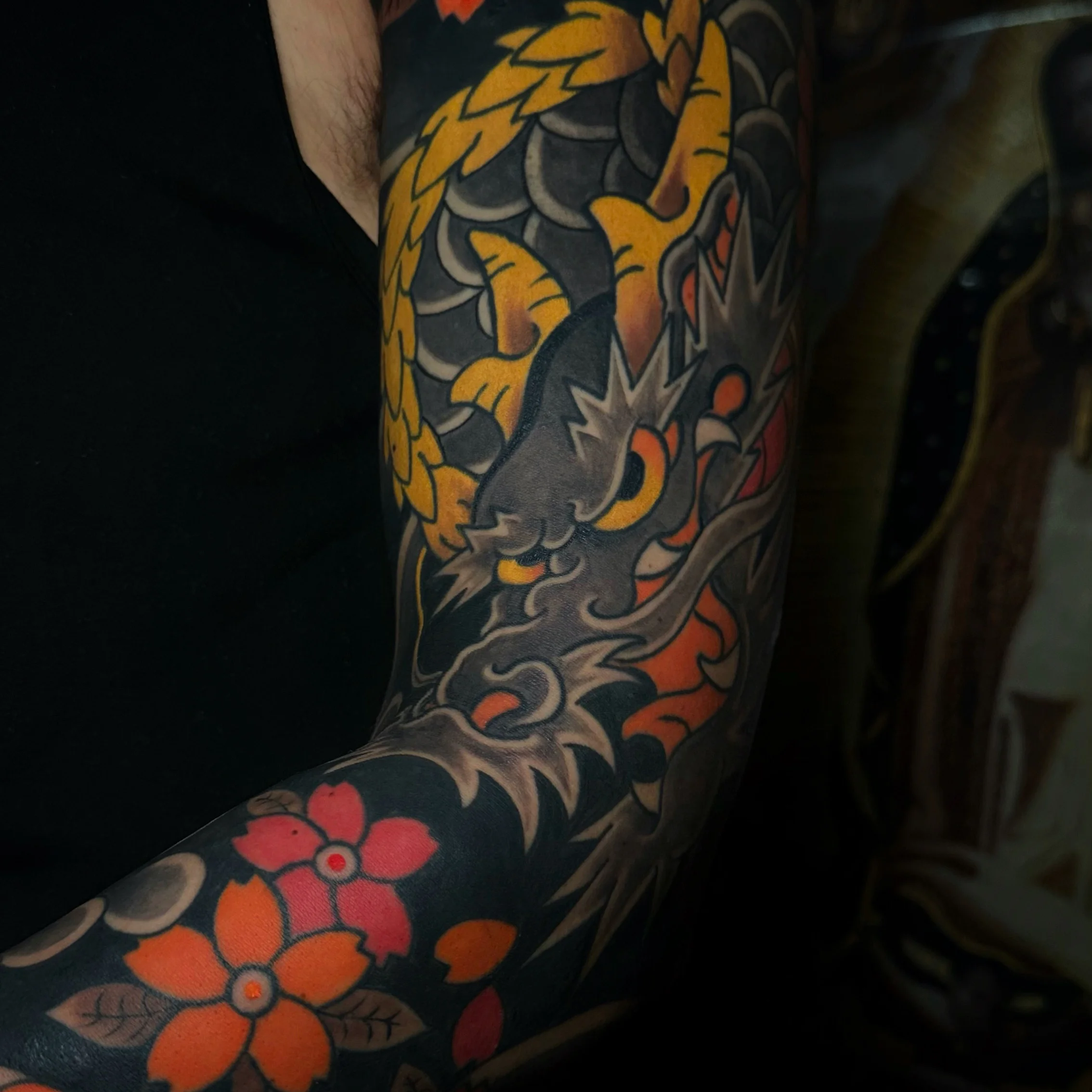 Japanese tattoo by Alessio Ventimiglia: dragon, flower, scales, horns