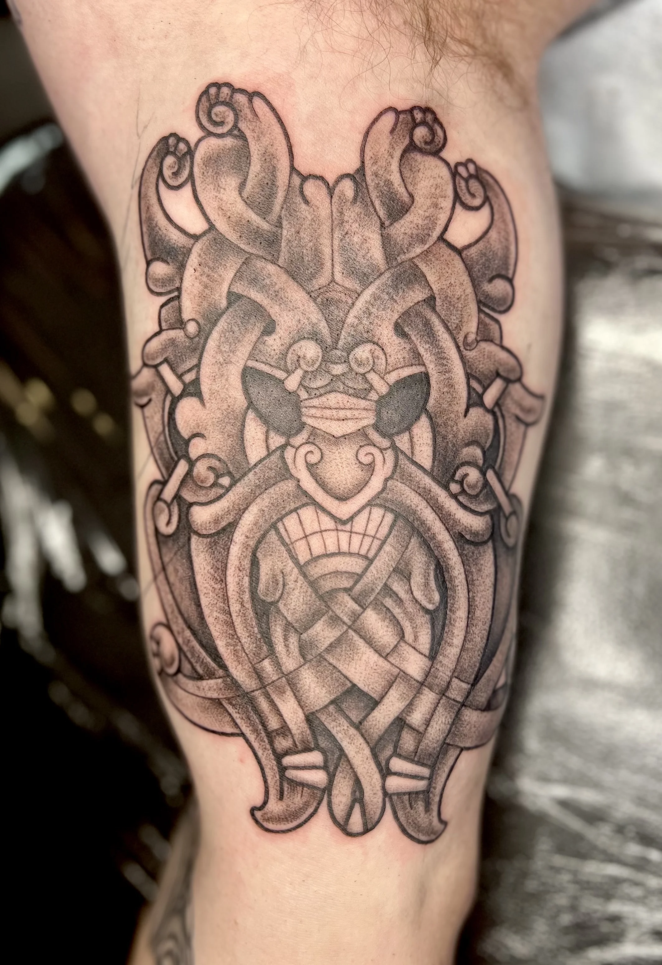 Blackwork tattoo by Justin Wilson: knotwork, mask, face, horns