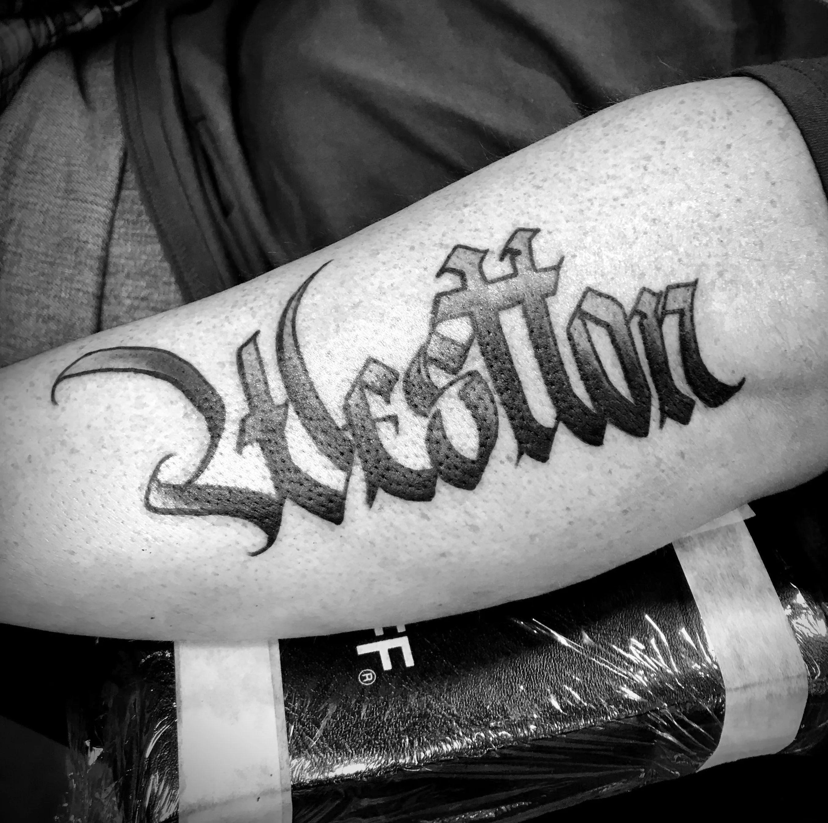 Blackwork tattoo by Justin Wilson: lettering, script, typography, bold