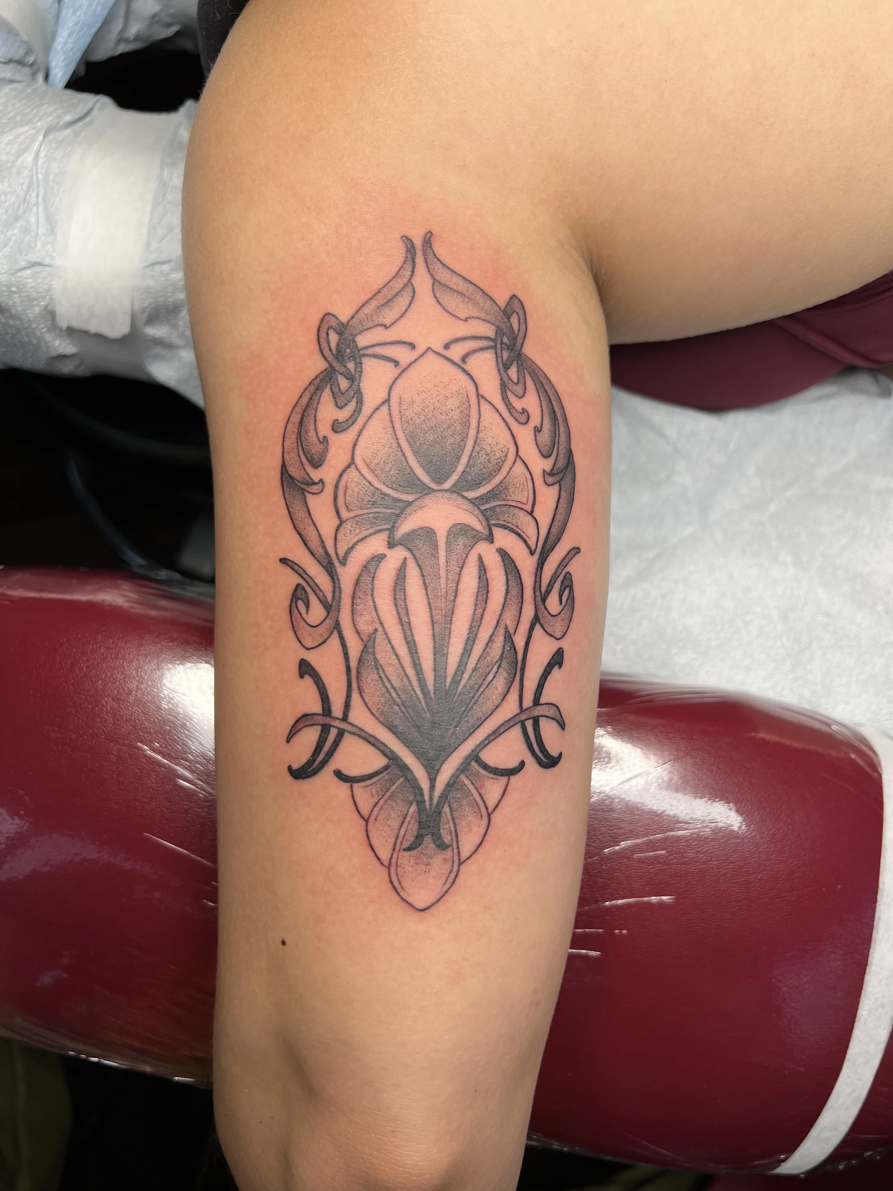 Blackwork tattoo by Justin Wilson: ornamental shapes, leaf motif, abstract pattern, ornamental