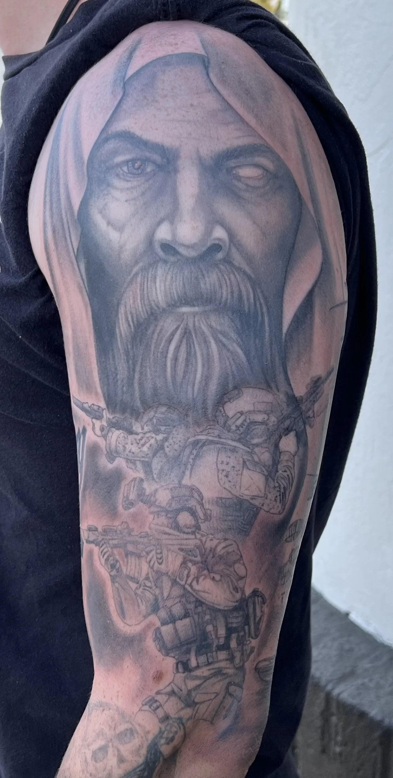 Bearded Man and Soldiers Half Sleeve: bearded man face, hood, robot soldier, gun, skull, military