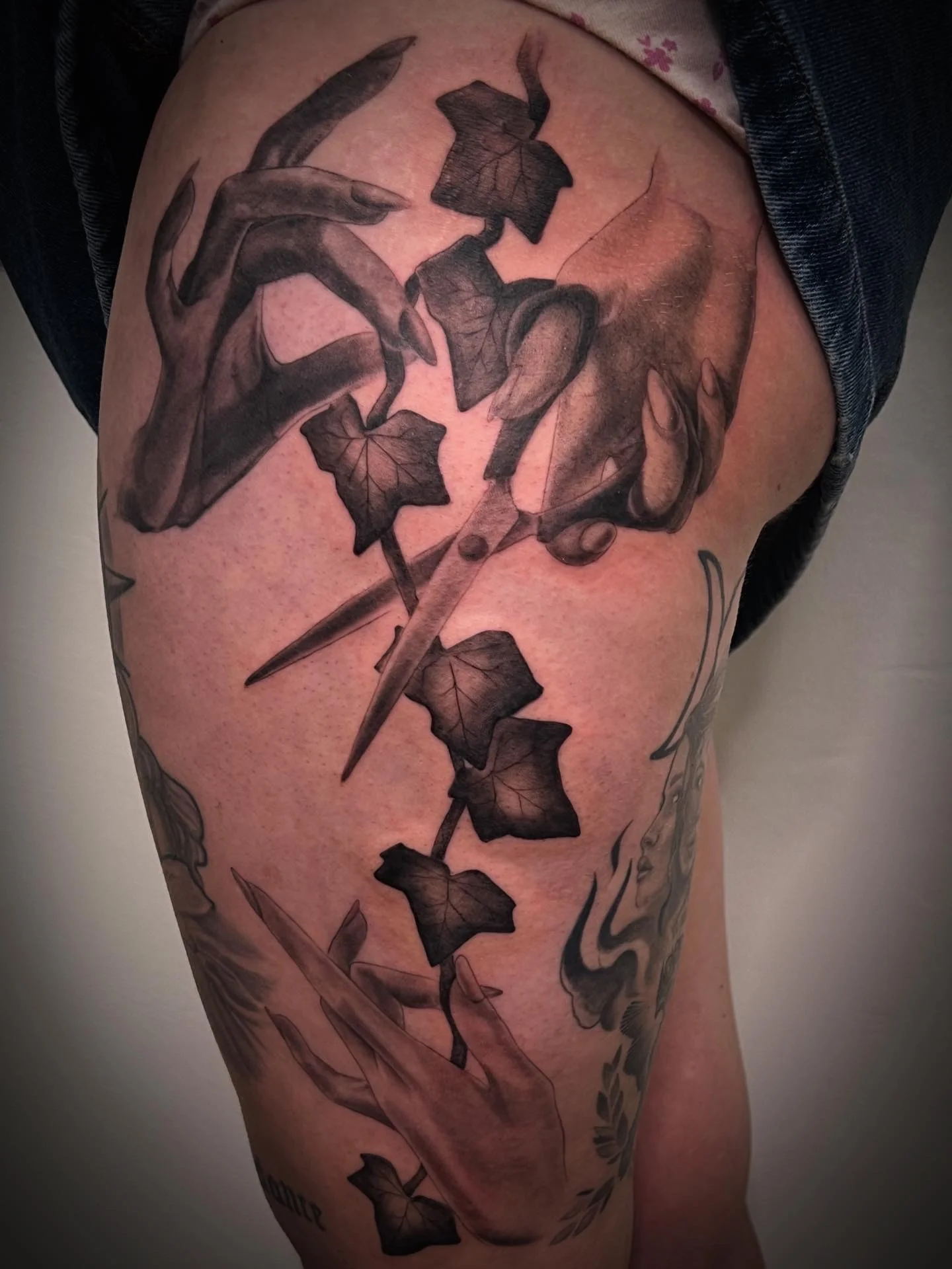 Black & Gray Realism tattoo by Justin Wilson: hands, scissors, ivy leaves, nature