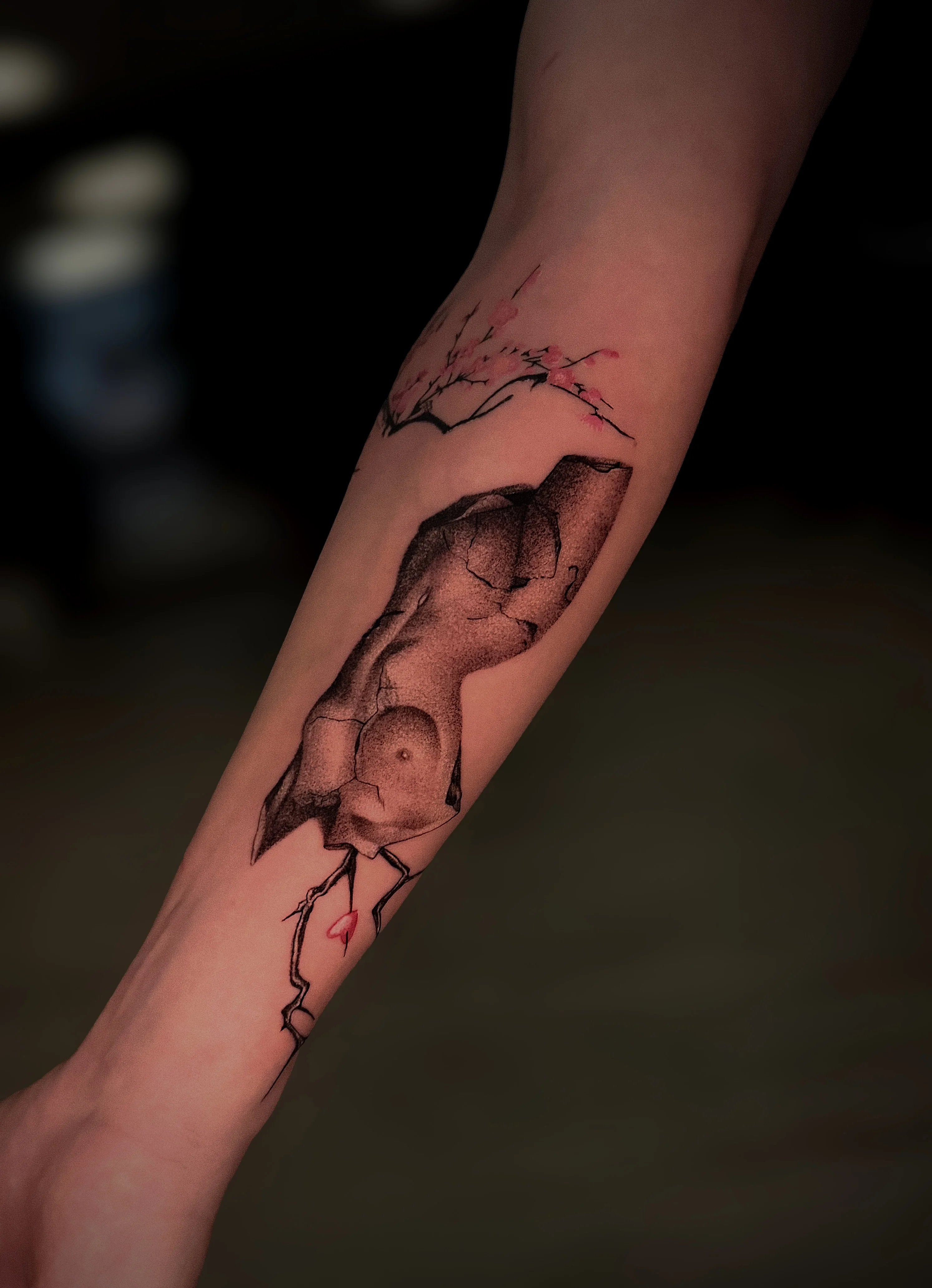 Black & Gray Realism tattoo by tattoo.naz777: rock formation, branch, small flowers, bird