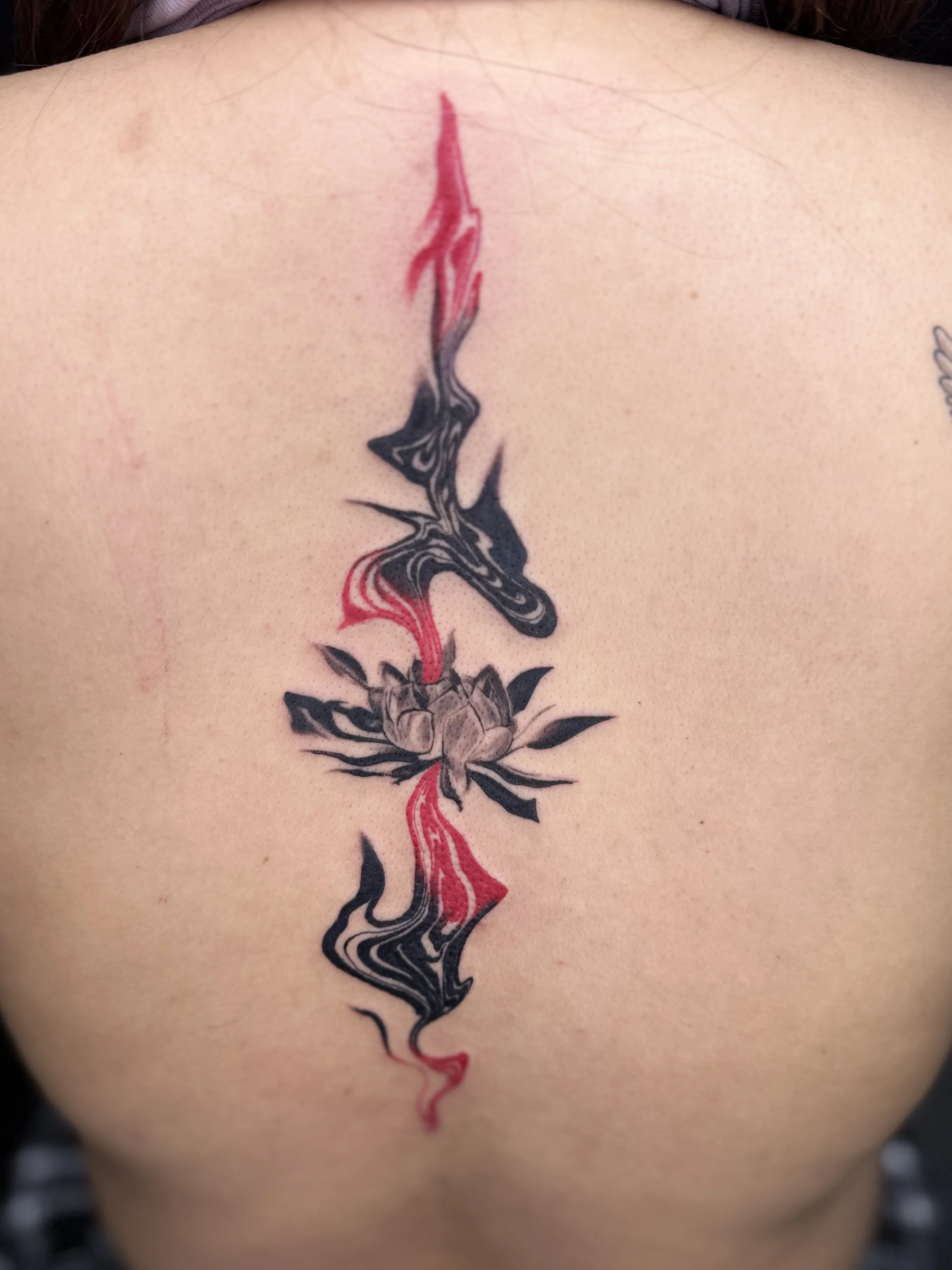 Surrealism tattoo by Churry Tattoos: lotus flower, abstract shapes, ribbons, fluid patterns