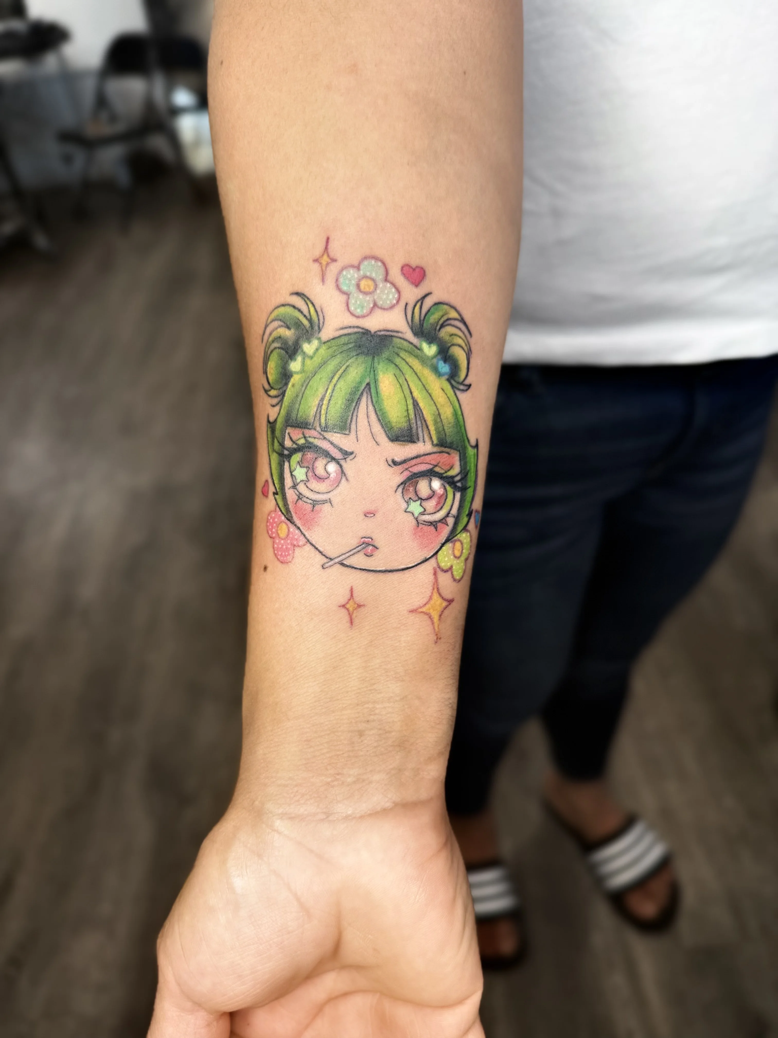 Anime Girl Face Forearm: girl face, green hair, sparkles, flowers, heart, lollipop
