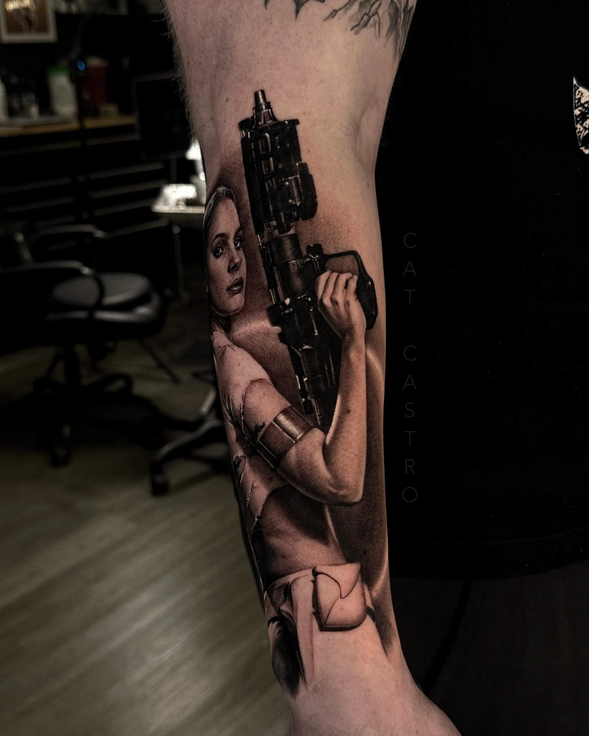 Black & Gray Realism tattoo by Cat Castro: woman, gun, arm band, star wars