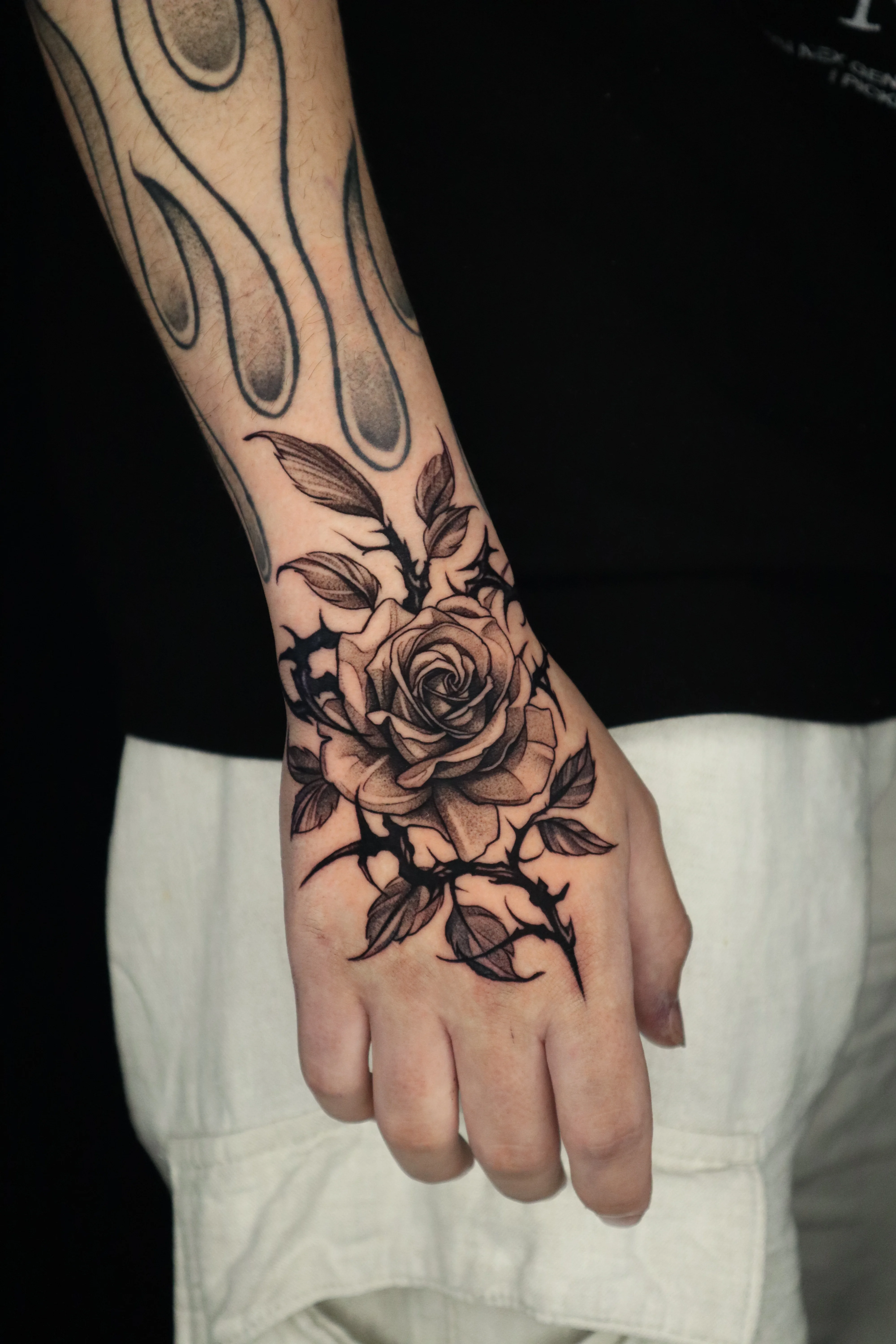 Black & Gray Realism tattoo by Kerasu: rose, thorny vine, leaf, floral
