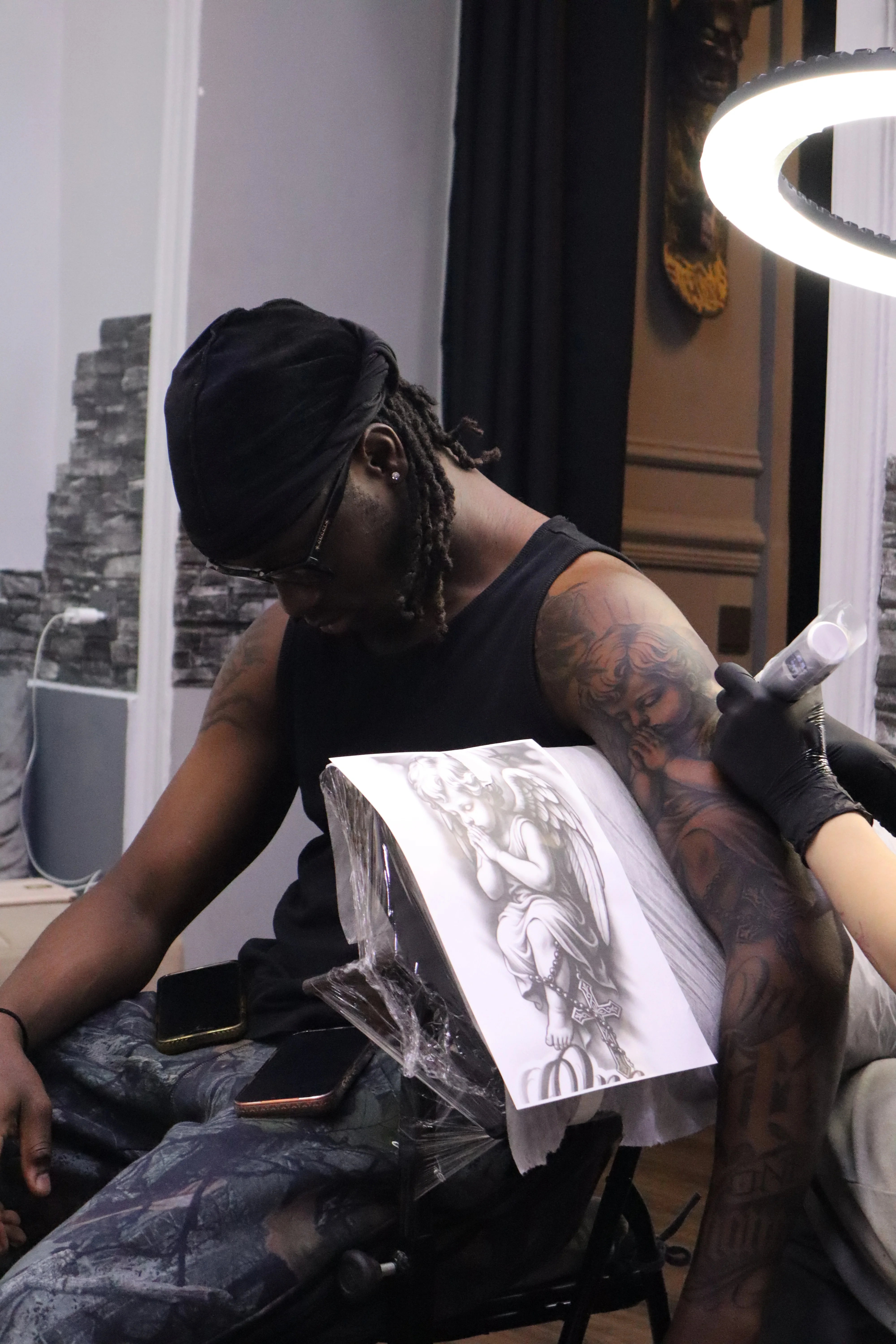 Black & Gray Realism tattoo by Kerasu: angel, woman, wings, face