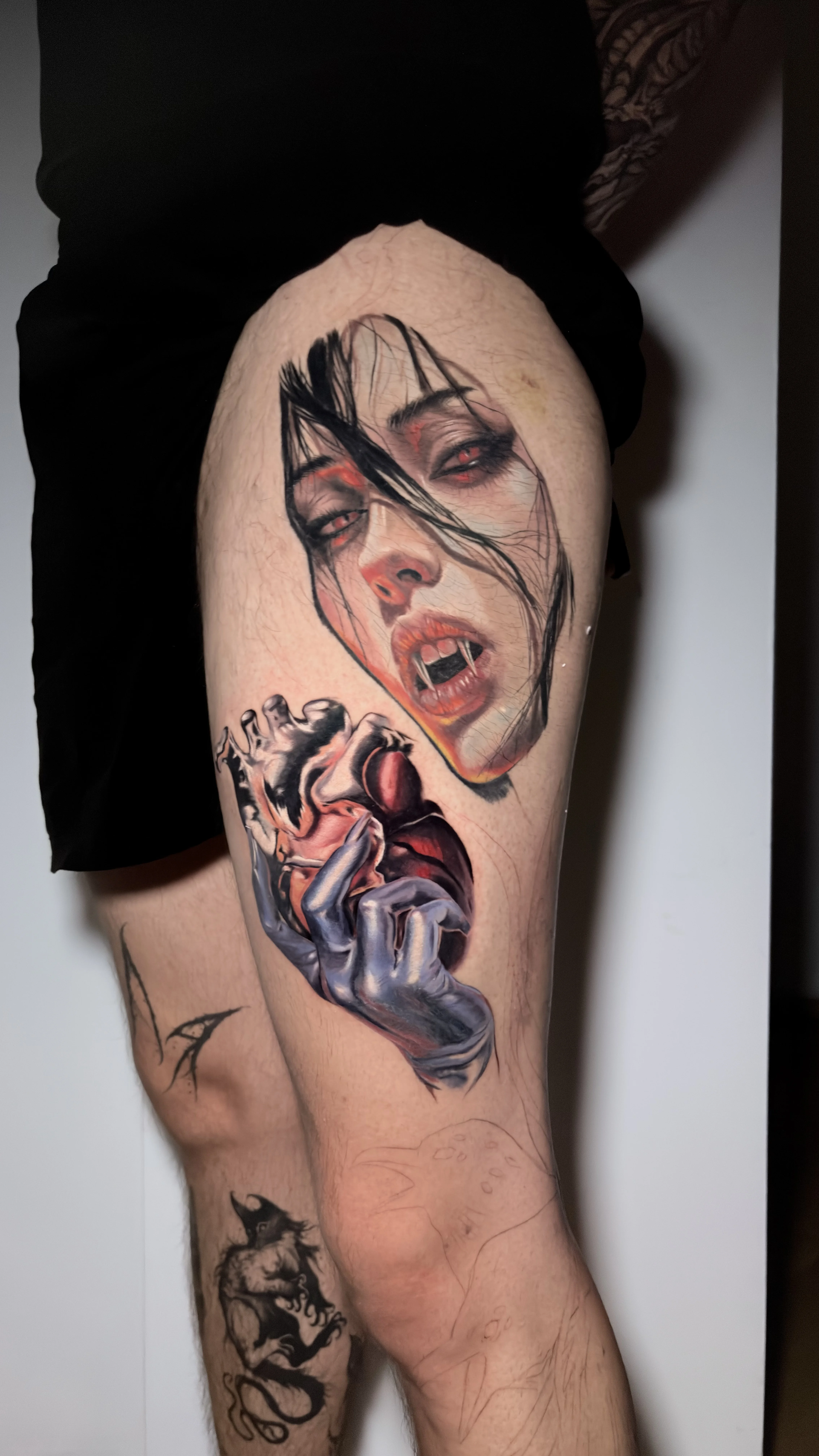 Vampire Woman With Heart Thigh: woman, hand, anatomical heart, vampire fangs, long hair, dark