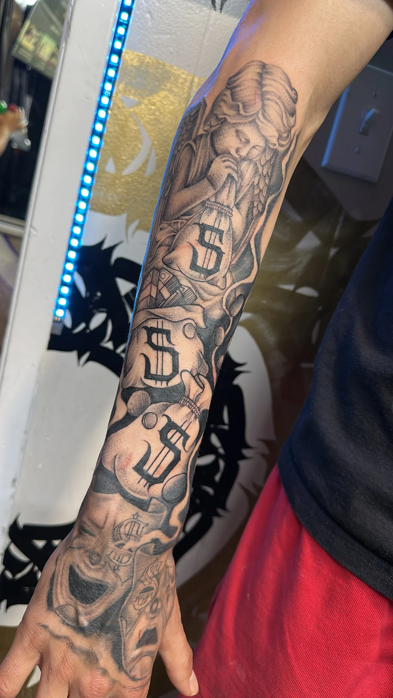 Black & Gray Realism tattoo by Bumpy Munoz: girl, money bag, skull, clown face